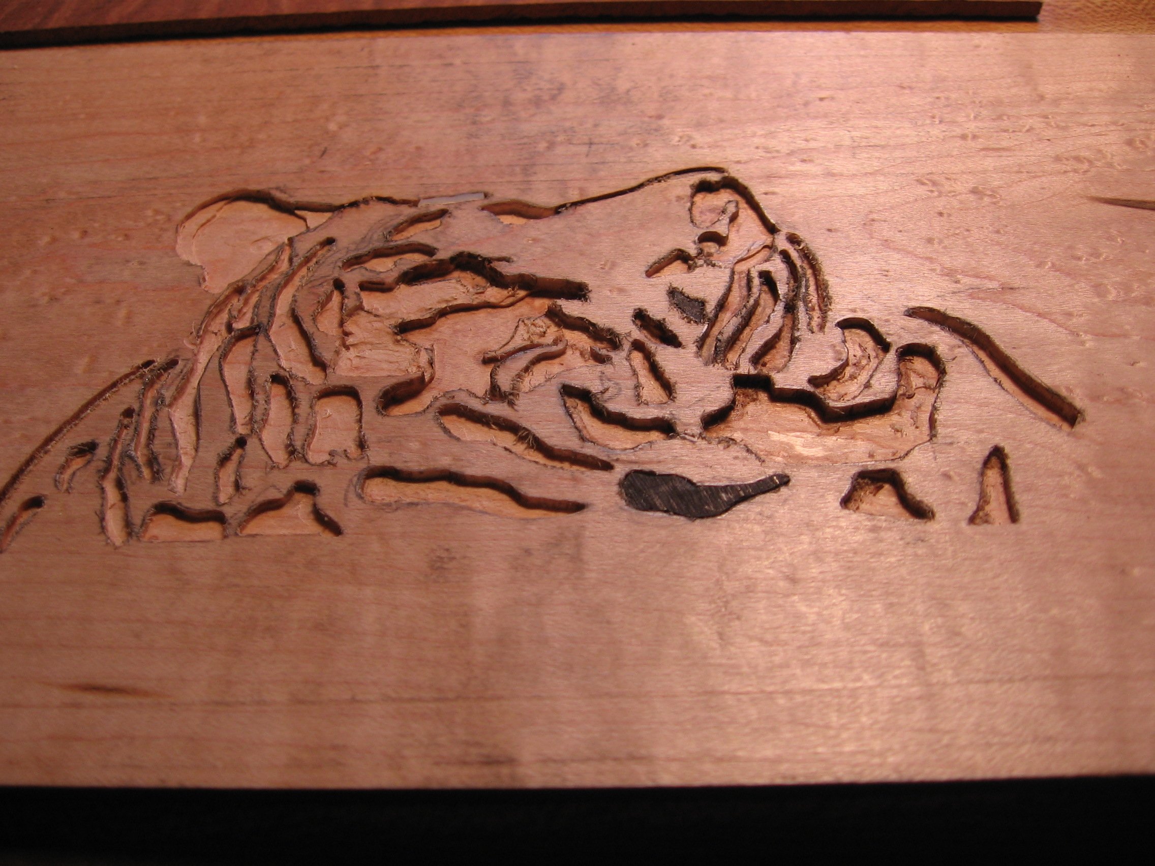 Beginning of inlay of Tiger Head for headstock of archtop Guitar, made by Elaine Moulton, Immortal Guitars.