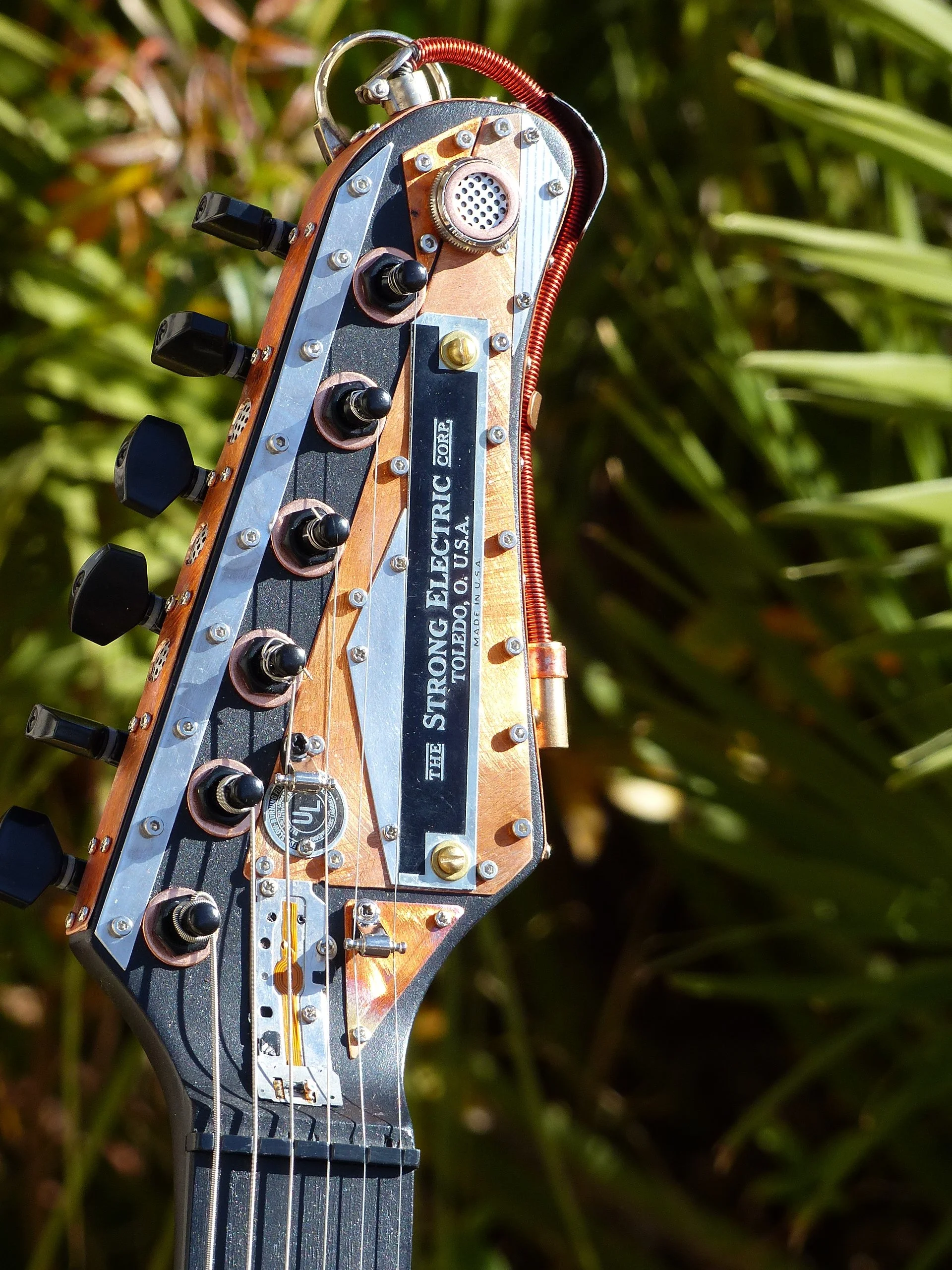 strong electric steampunk jan 2026 headstock.JPG