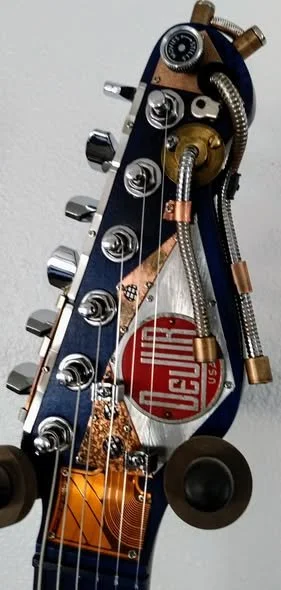 Headstock from Steampunk Guitar, Blue DuJur, Mike Moulton, luthier, Immortal Guitars, using parts from 8mm projector