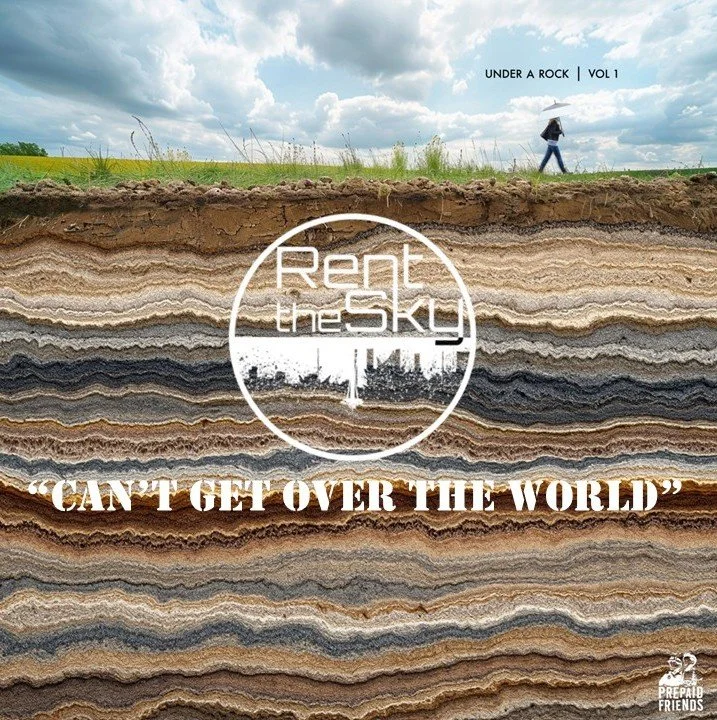 Cross-section of layered rocks with a person walking with an umbrella in a field under a cloudy sky. Text overlay: "Under a Rock | Vol 1," "Rent the Sky," and the quote "Can't get over the world."