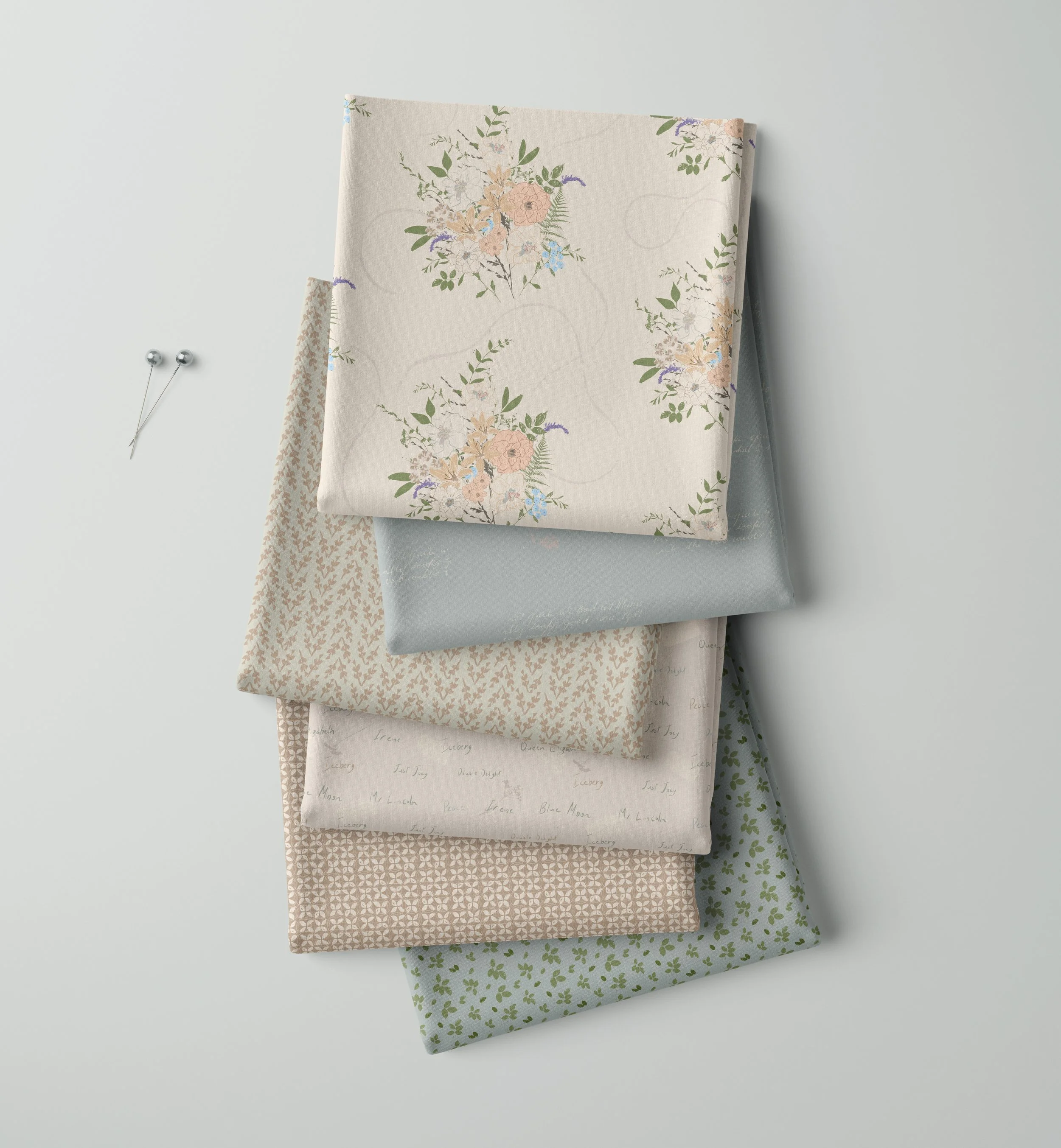 Memories in Bloom fabric collection in the Spring colourway, featuring soft floral, handwritten and botanical surface pattern designs in a stacked fabric mockup.