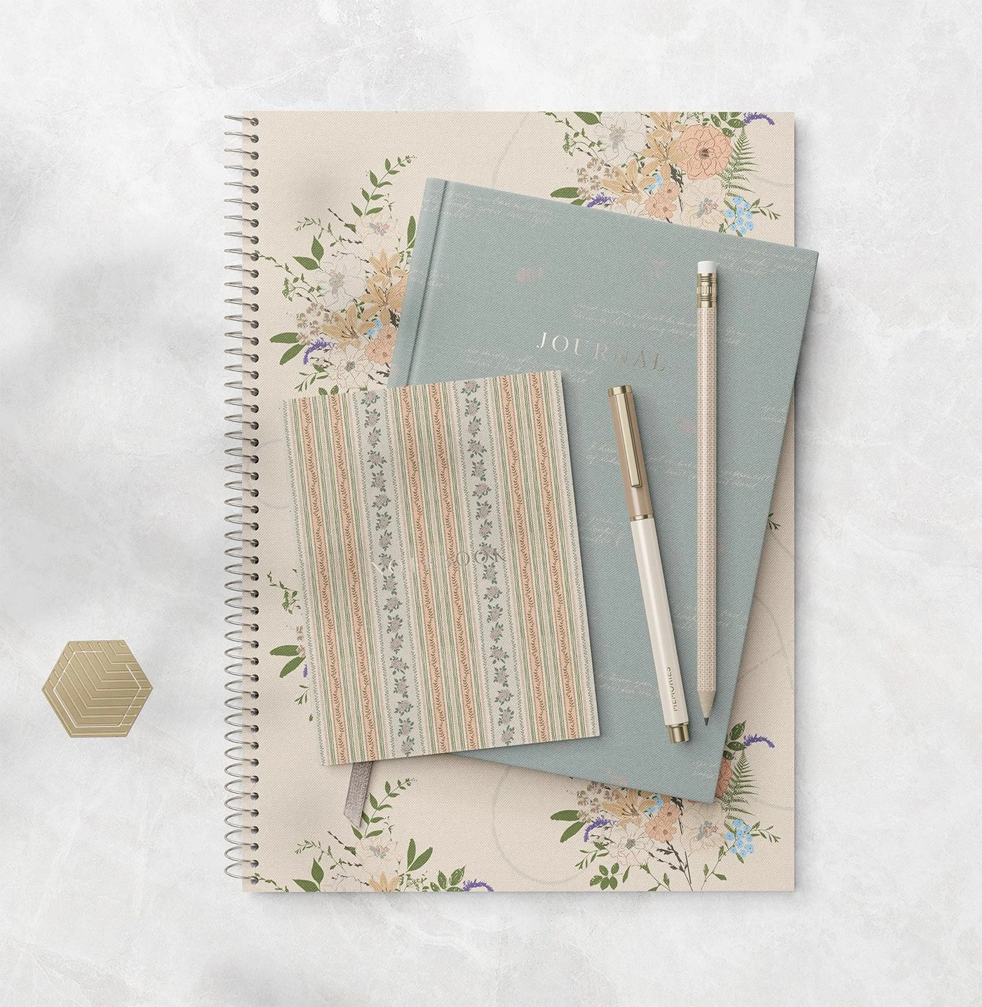 Memories in Bloom surface pattern designs shown on coordinated notebooks and stationery in soft botanical colours.
