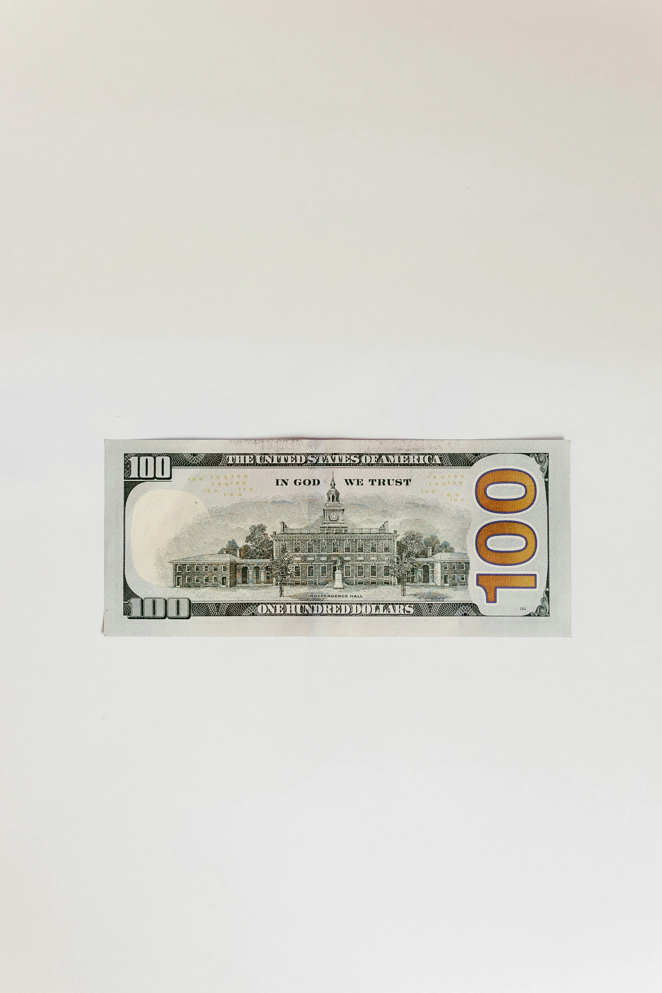 A hundred-dollar bill placed on a white background.
