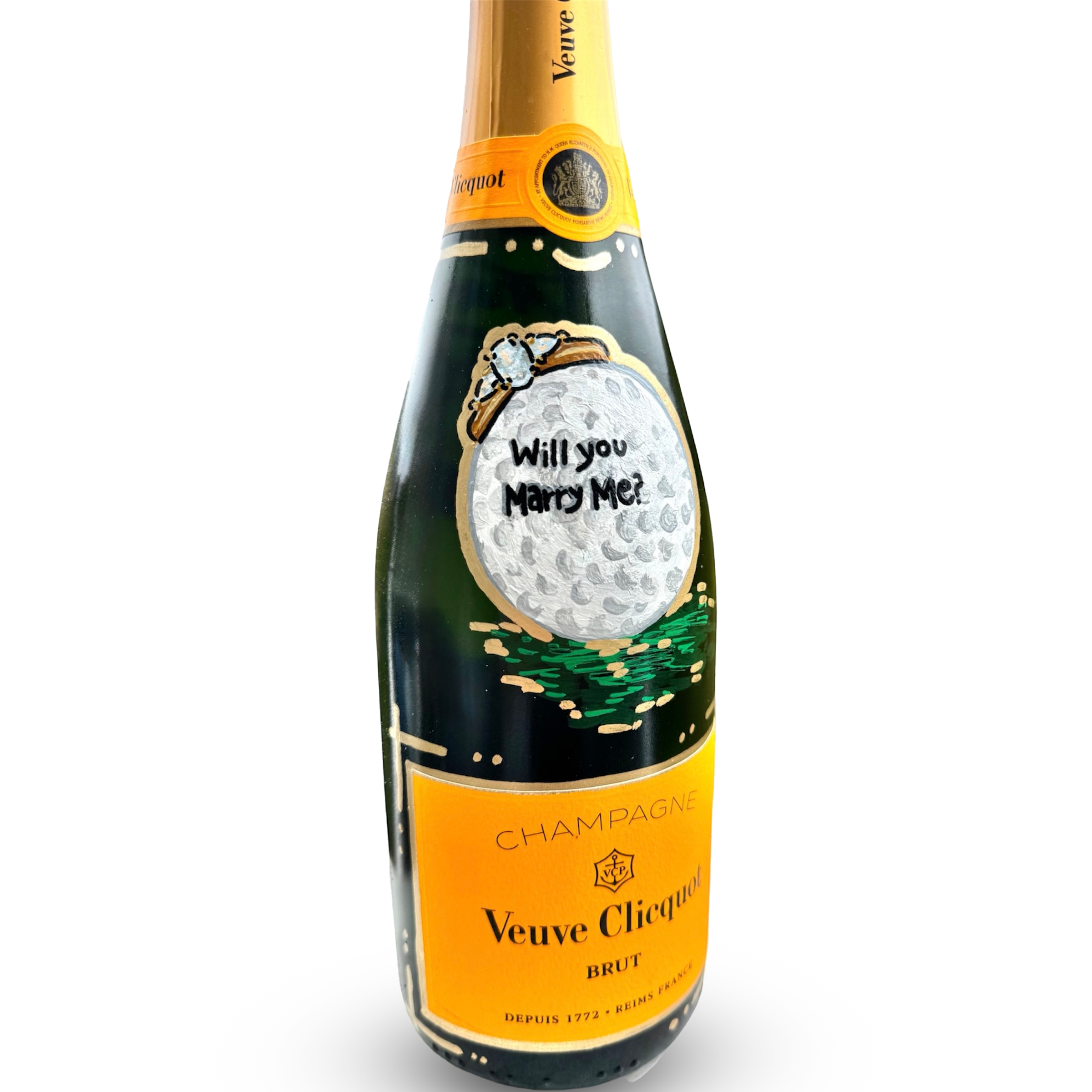 A champagne bottle with a yellow and black label that says Veuve Clicquot. The label has a drawing of a polar bear holding a piece of ice and the phrase 'Will You Marry Me?' written on it.