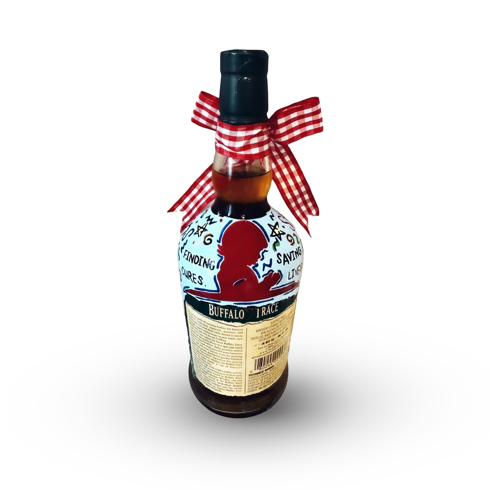 A Coca-Cola bottle decorated with a clown face, words related to the circus, and a red and white checkered ribbon tied in a bow around the neck of the bottle.