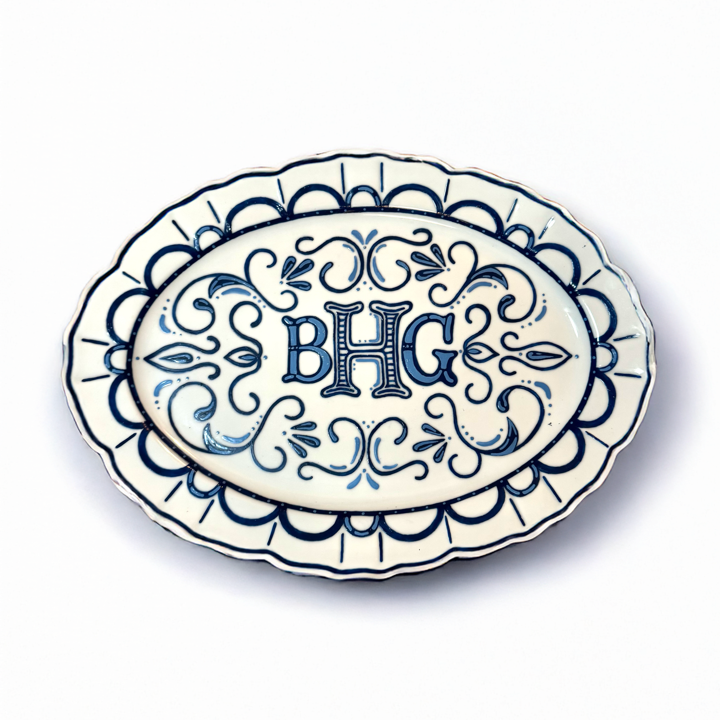 Blue and white custom decorative ceramic plate with intricate cut-out design, shown against a plain white background.