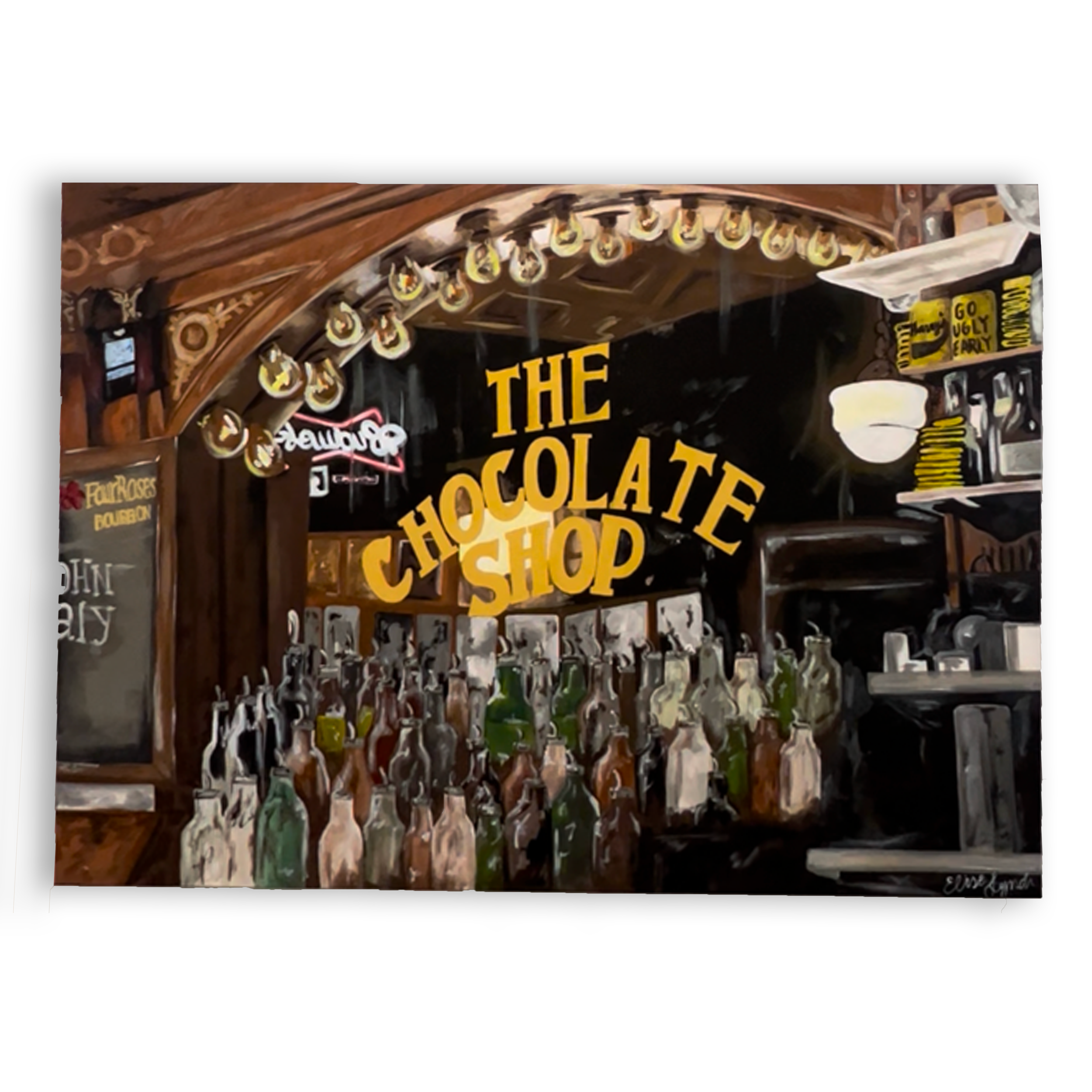 A custom sign for a chocolate shop with a wooden frame, featuring lightbulbs along the top, and various decorative elements, including a bowl, bottles, and handwritten signs. For Purdue University.