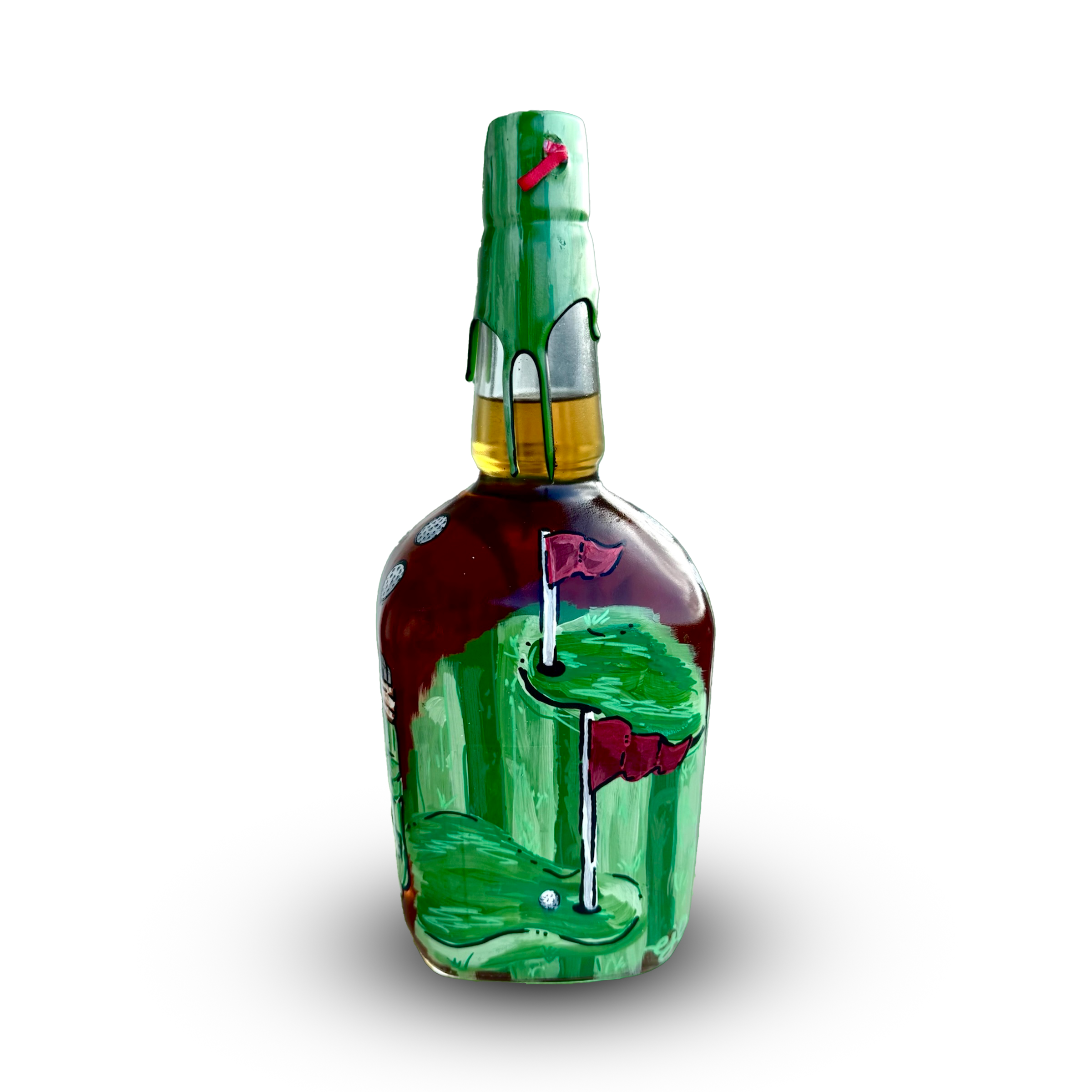 A close-up photo of a beer bottle with green paint drip on top, a red ribbon, and a sticker with a skull design.