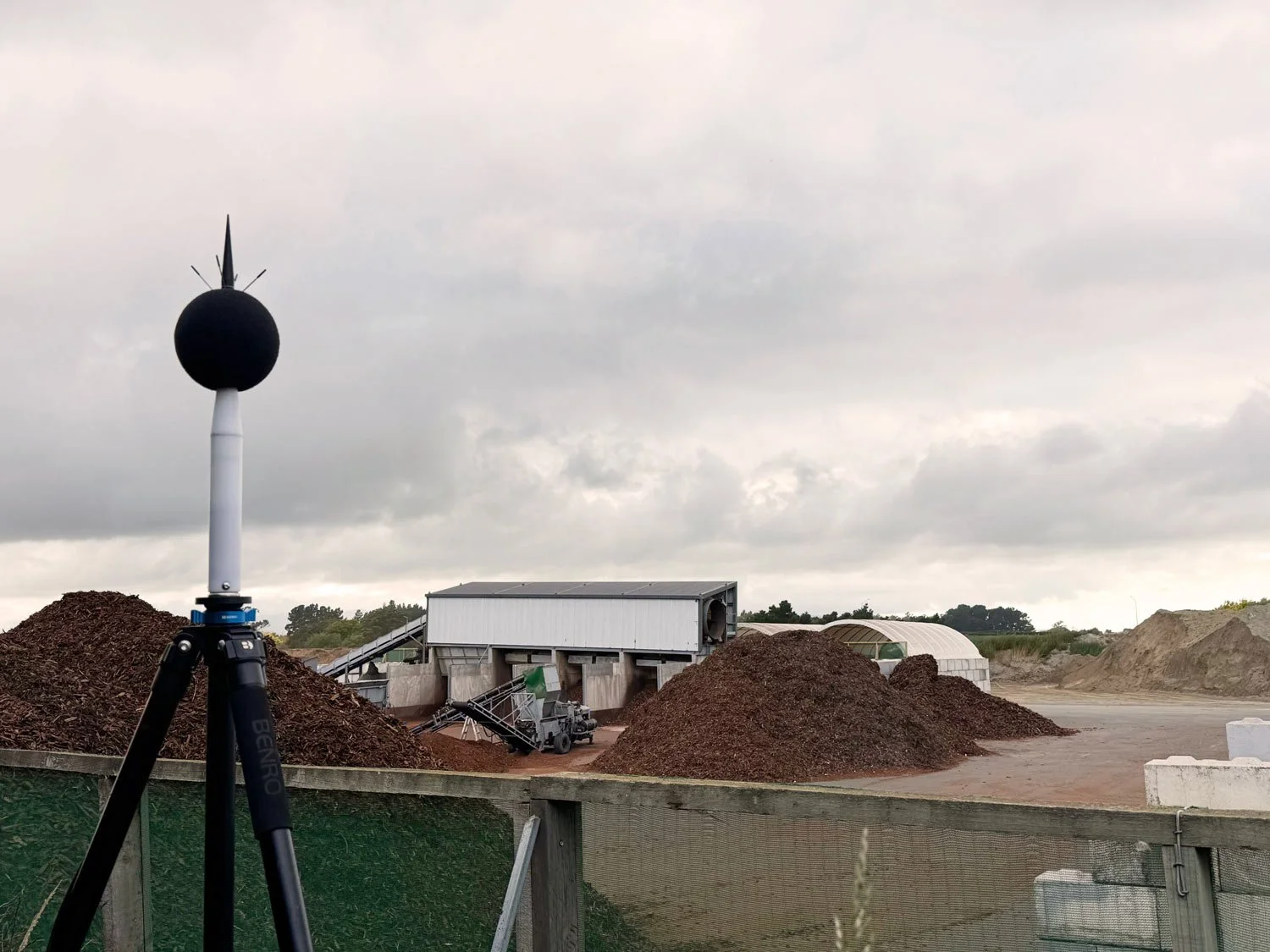 noise monitoring station at outdoor wood processing site