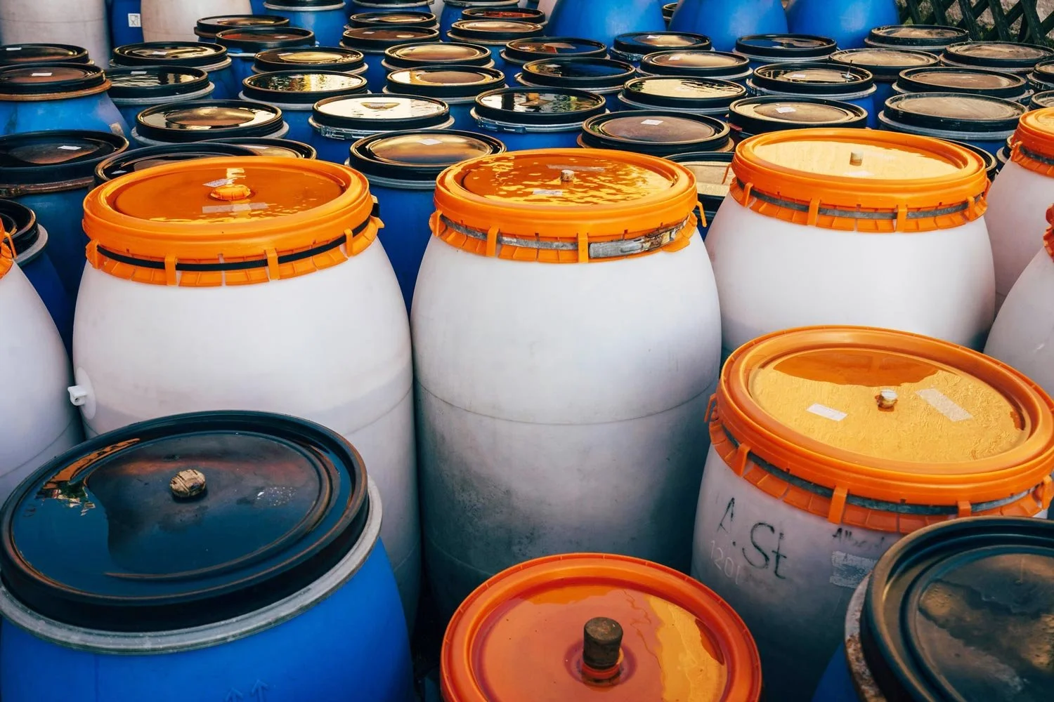 several barrels containing paints and chemicals