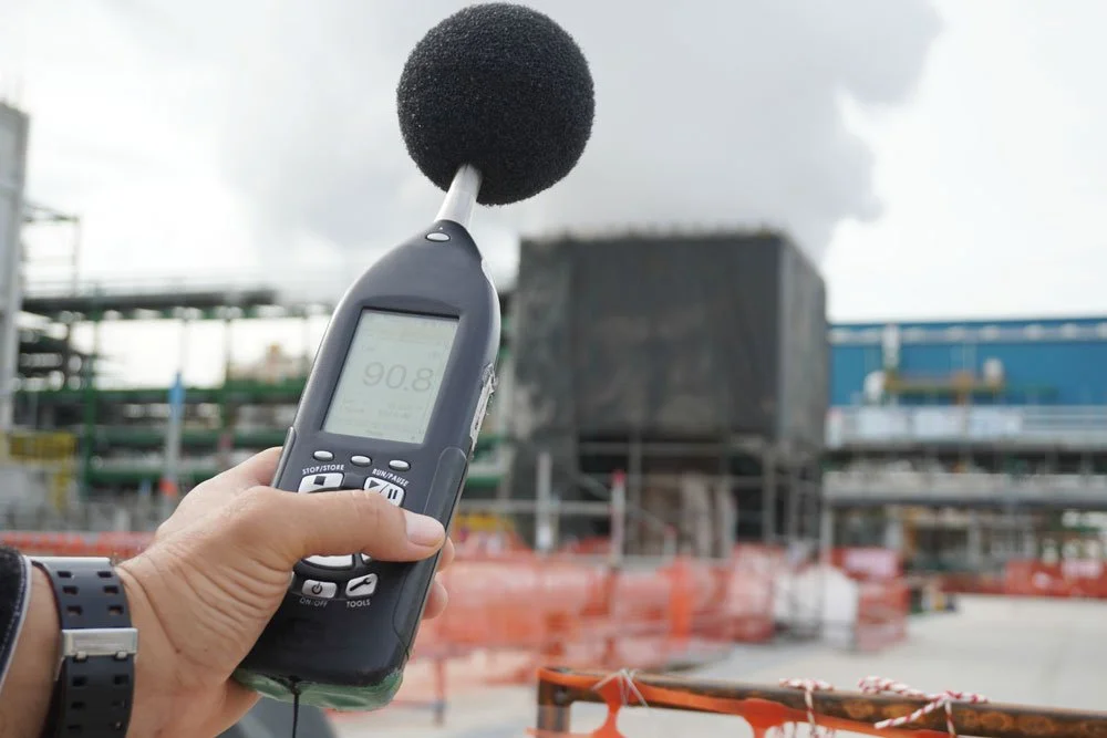 Hand of Environmental officer holding to use sound level meter for monitor is part of the prevention of environmental impacts