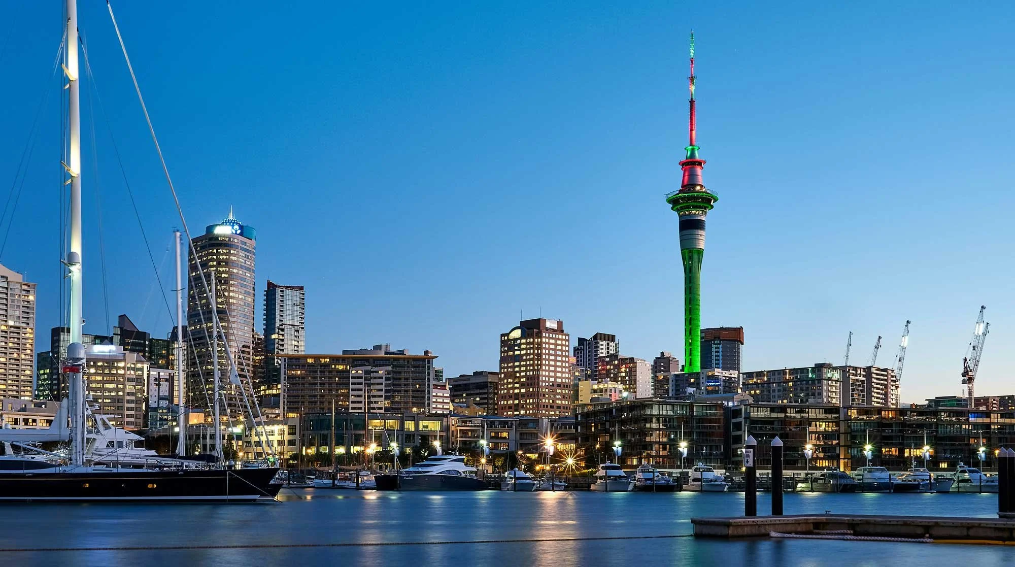 auckland waterfront with buildings, sky tower and boats, marina in the foreground