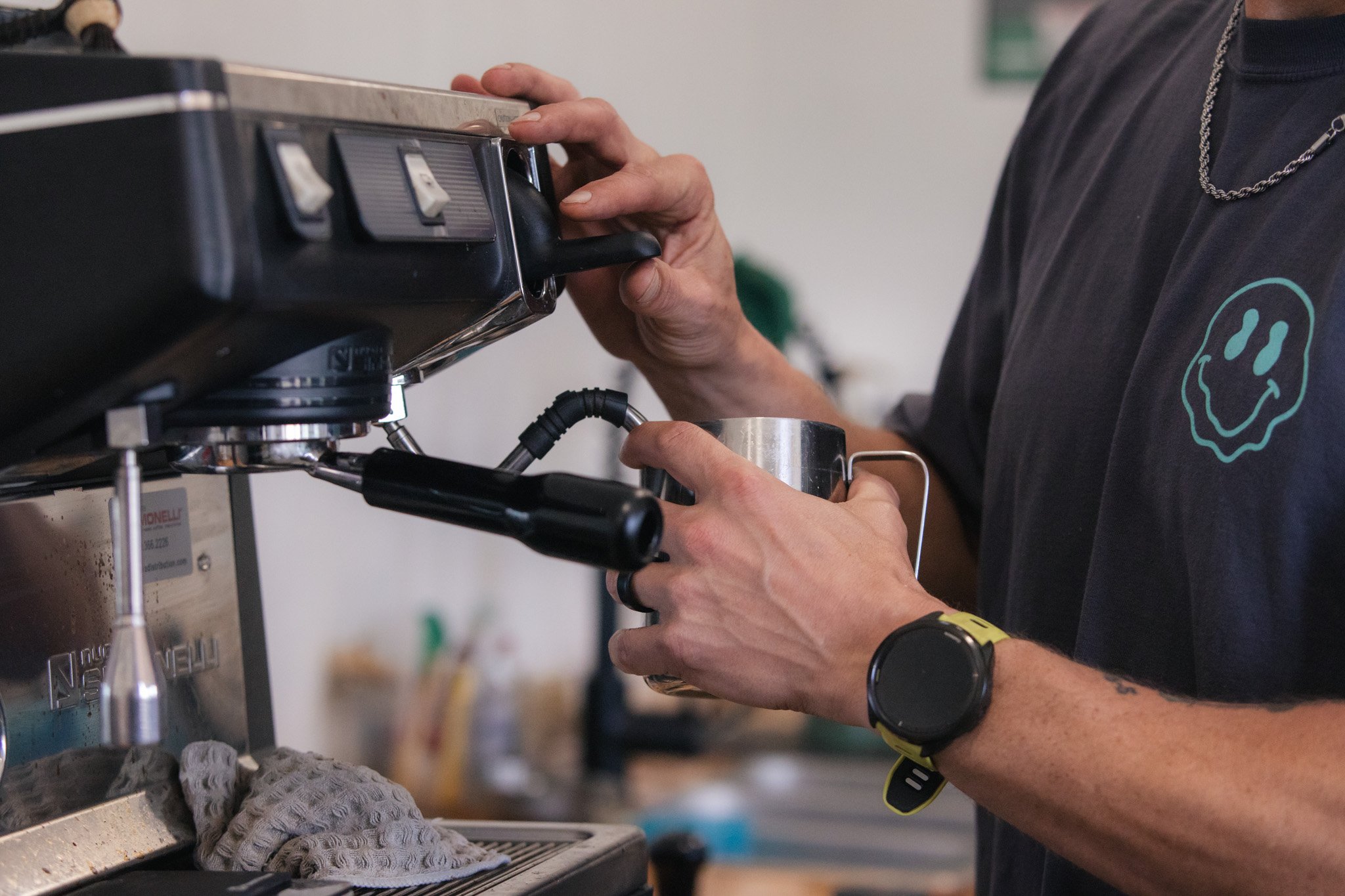 An image of the owner steaming milk