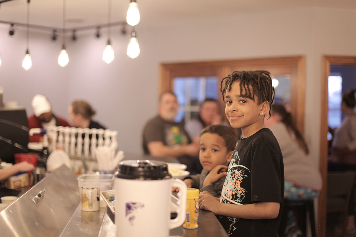An image of the children at the coffee bar.