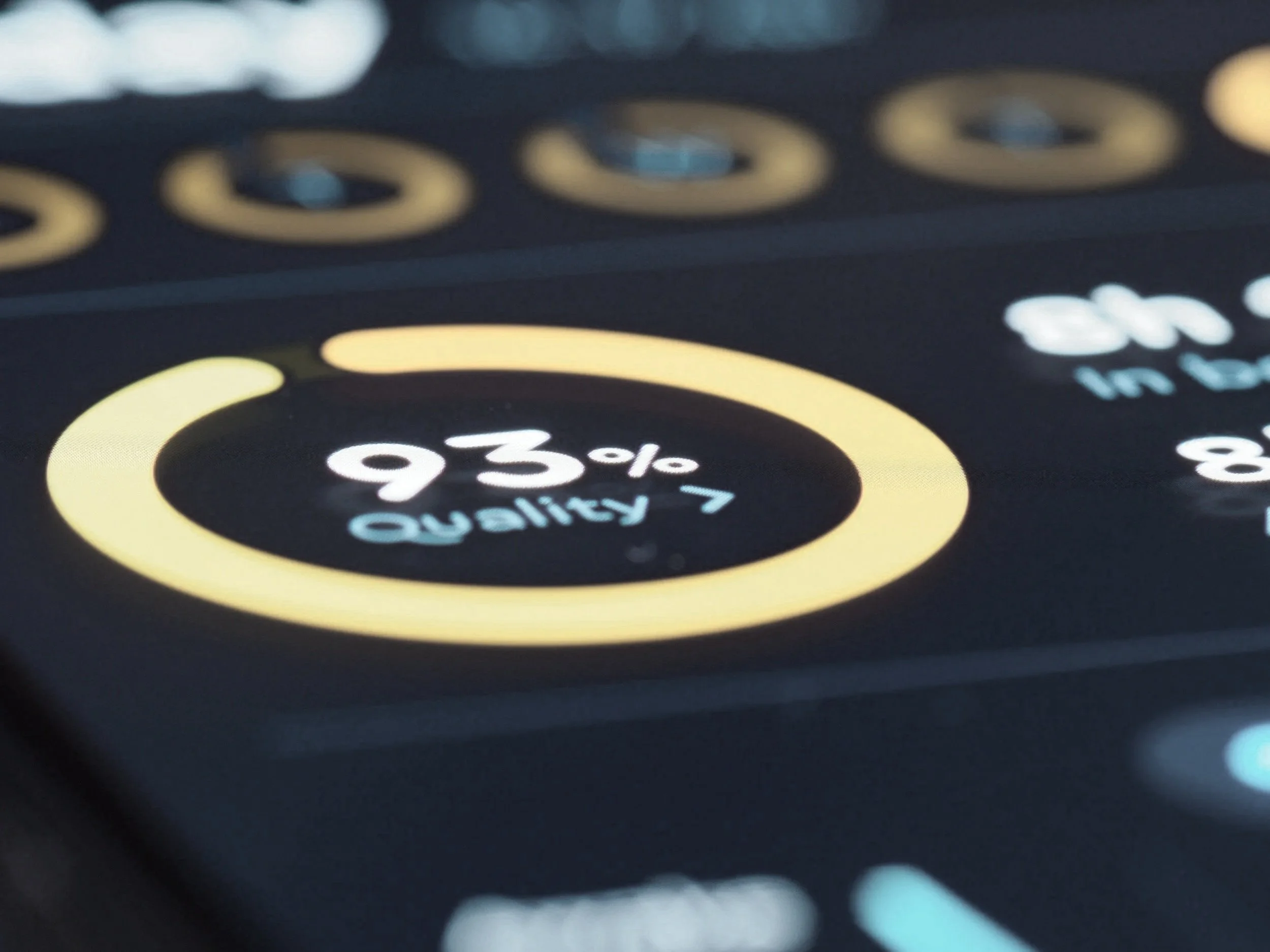 Close-up of a digital device screen displaying a circular progress indicator at 93% with the label 'Quality 7'.