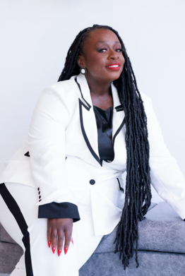 Dr. Sheronda Witter holding the Why Not book