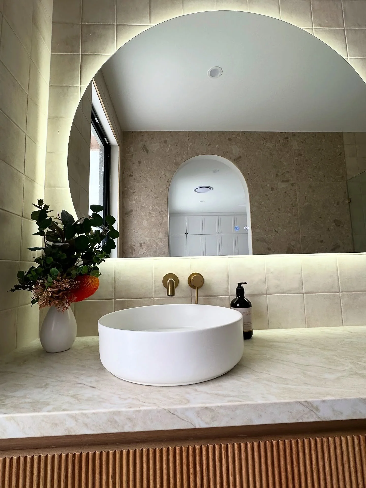 ⭐️Your dream bathroom starts here. ⭐️

Curved arches, a floating vanity, warm brass tapware, and soft backlighting &ndash; this bathroom is the perfect mix of modern luxe and timeless design. 🌿✨

Recreate this amazing design and let us help bring yo