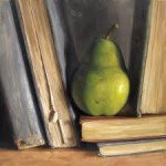Pear nestled between worn books on bookshelf.