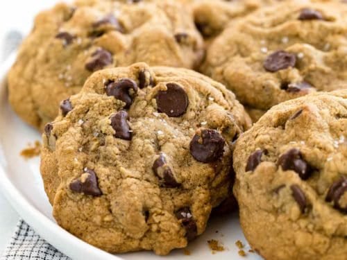Mouth-watering chocolate cookies piled on a plate.