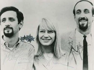 Black and white portrait of the American folk group, Peter, Paul, and Mary.
