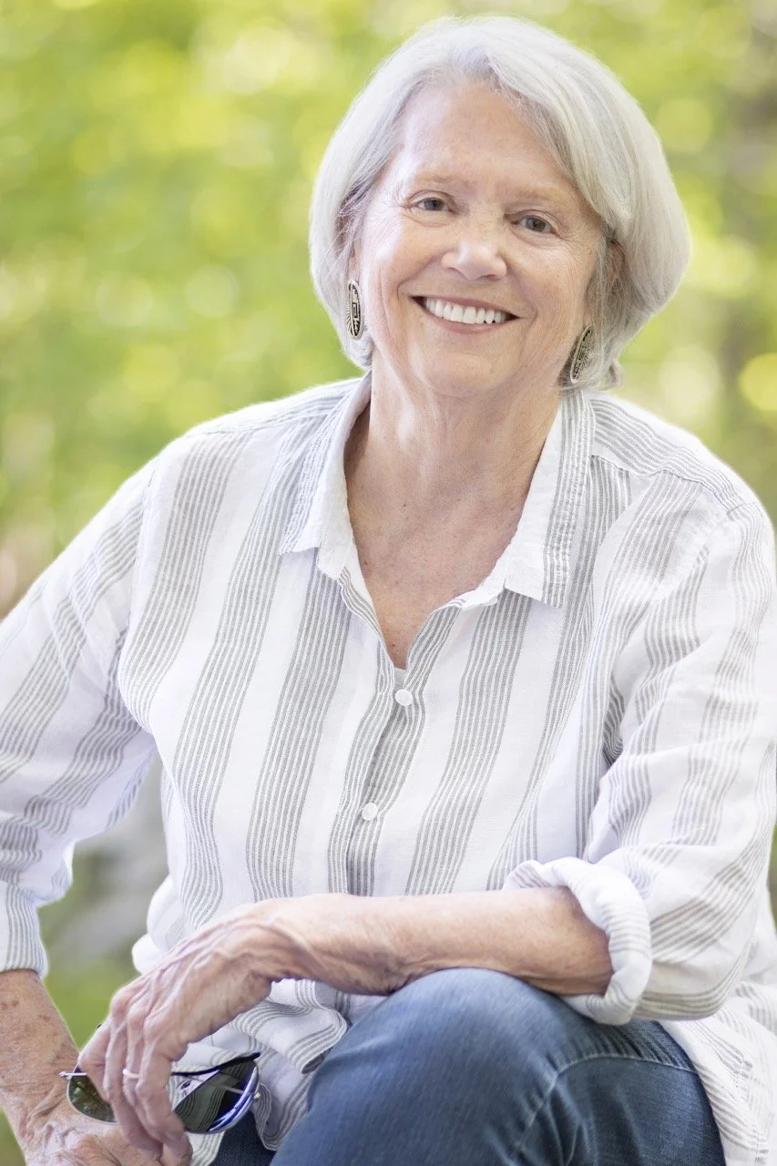 Portrait of Kate Woodworth with a relaxed smile.