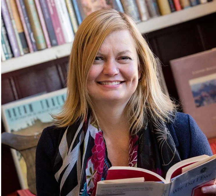 Nicole Walker, smiling in a bookstore.