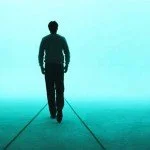 Man walking alone against a fluorescent blue background.