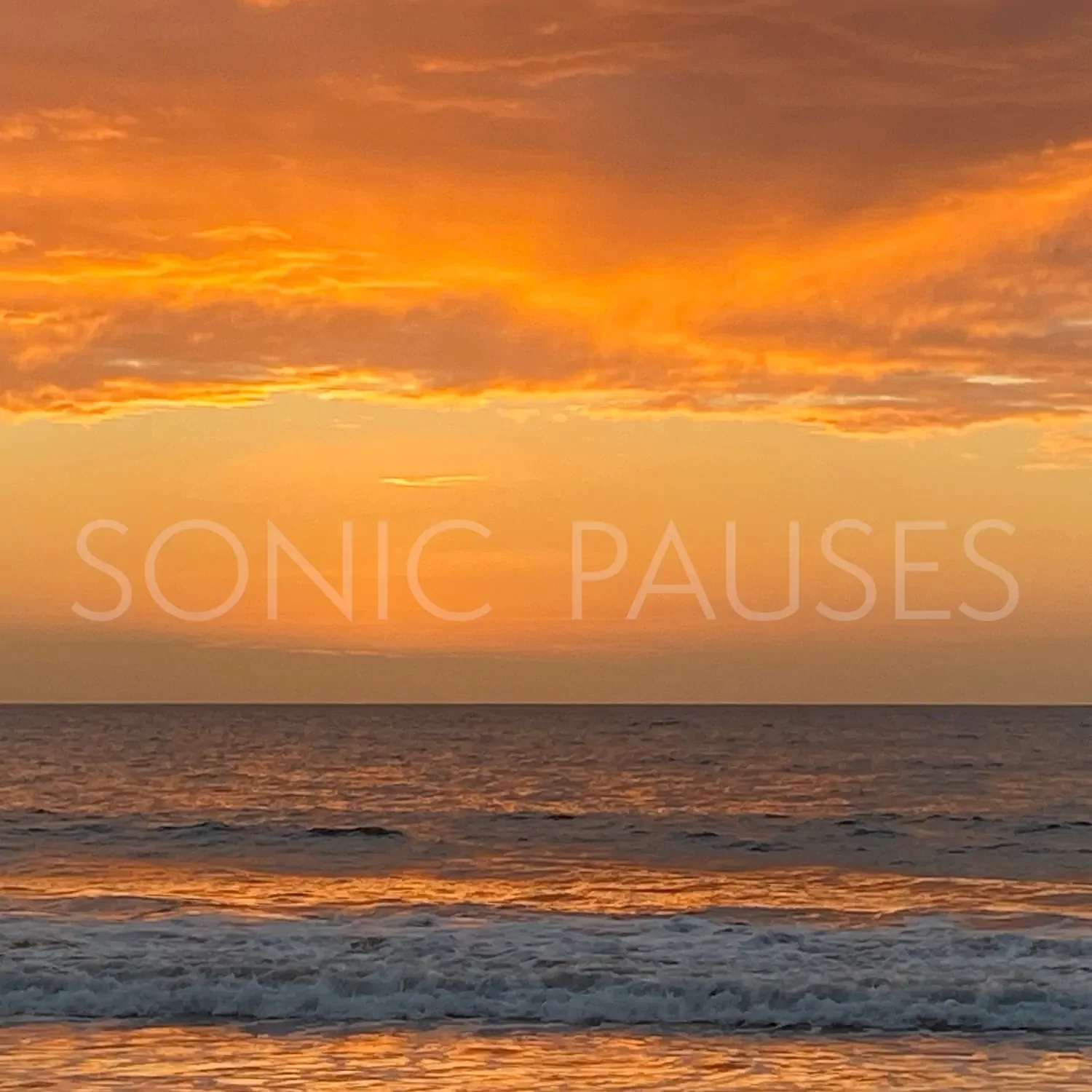Album cover for Sonic Pauses portraying a golden sunset over the ocean.