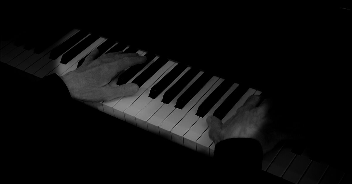 Maryliz Smith's hands on piano keys.