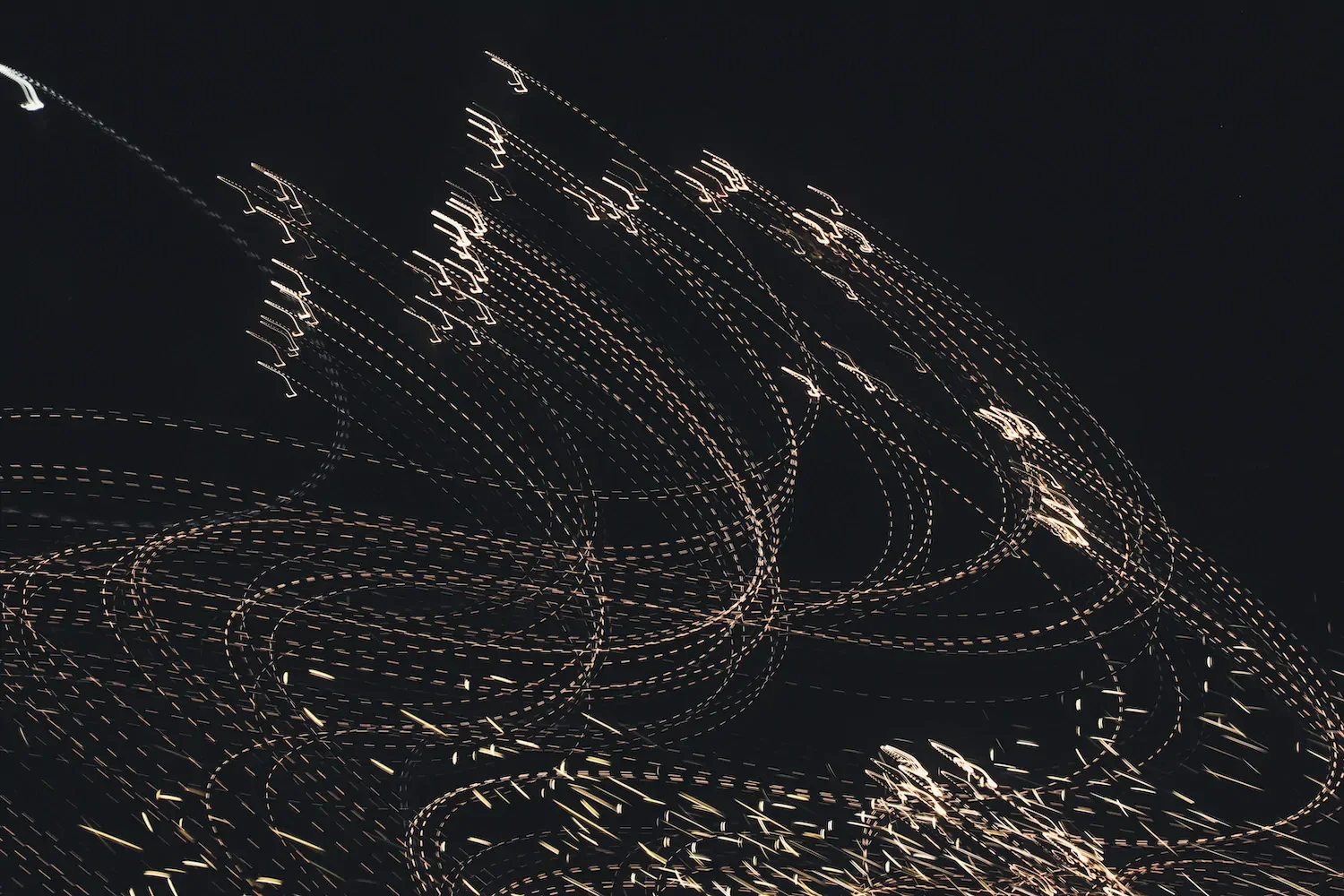 An abstract image of golden musical notes in motion.