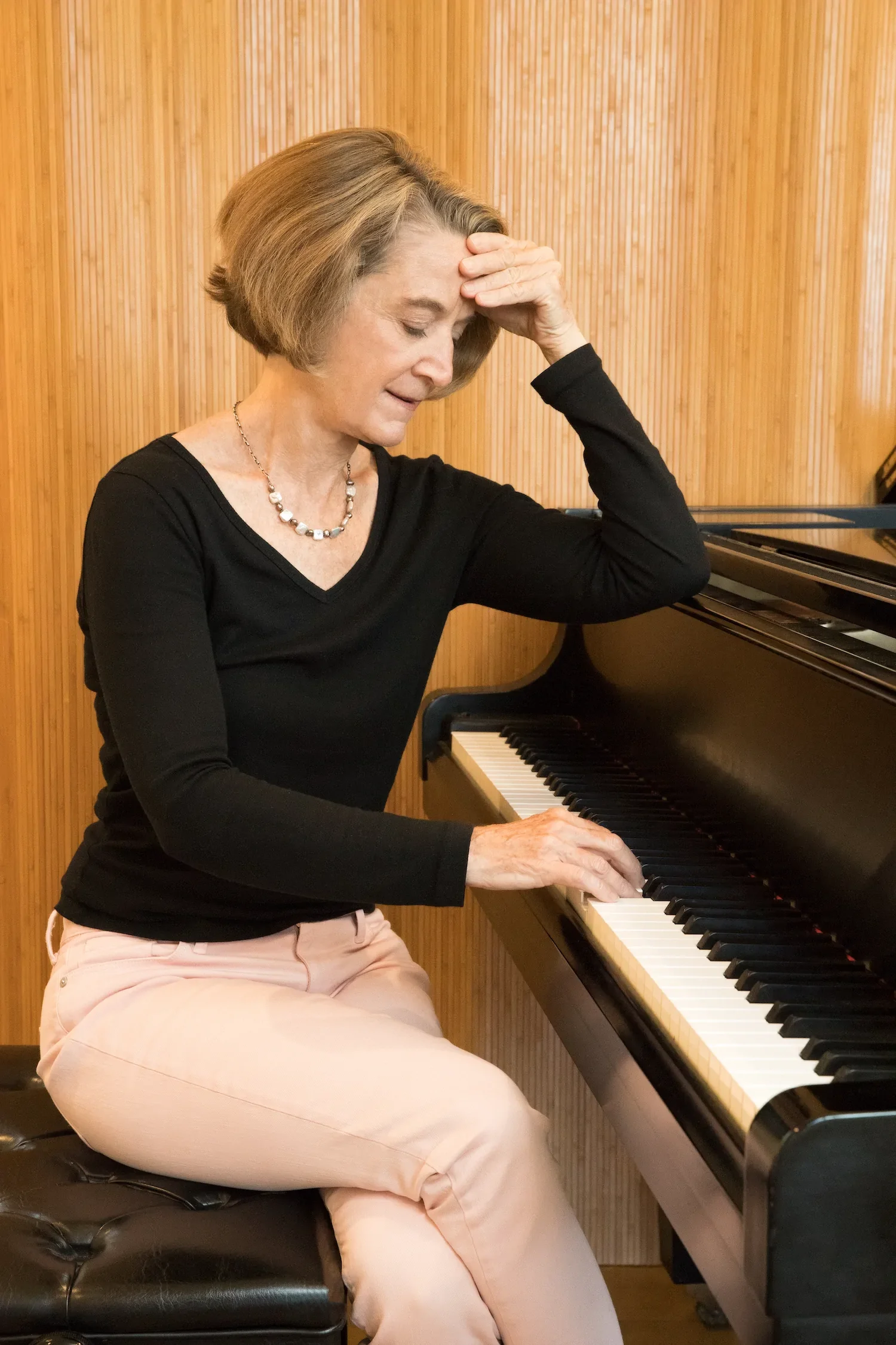 Maryliz Smith composing on a piano.