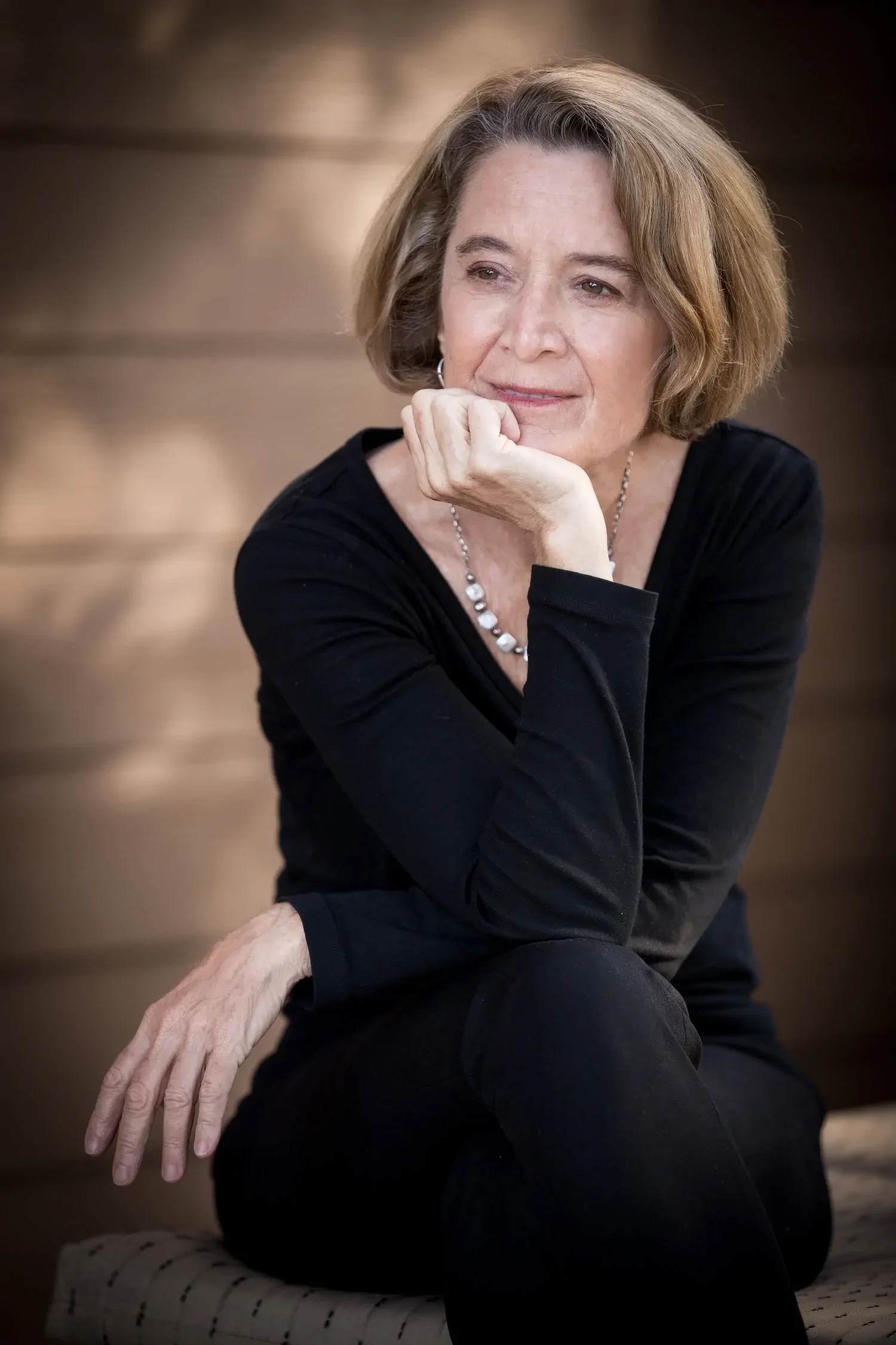 Maryliz Smith sitting outdoors