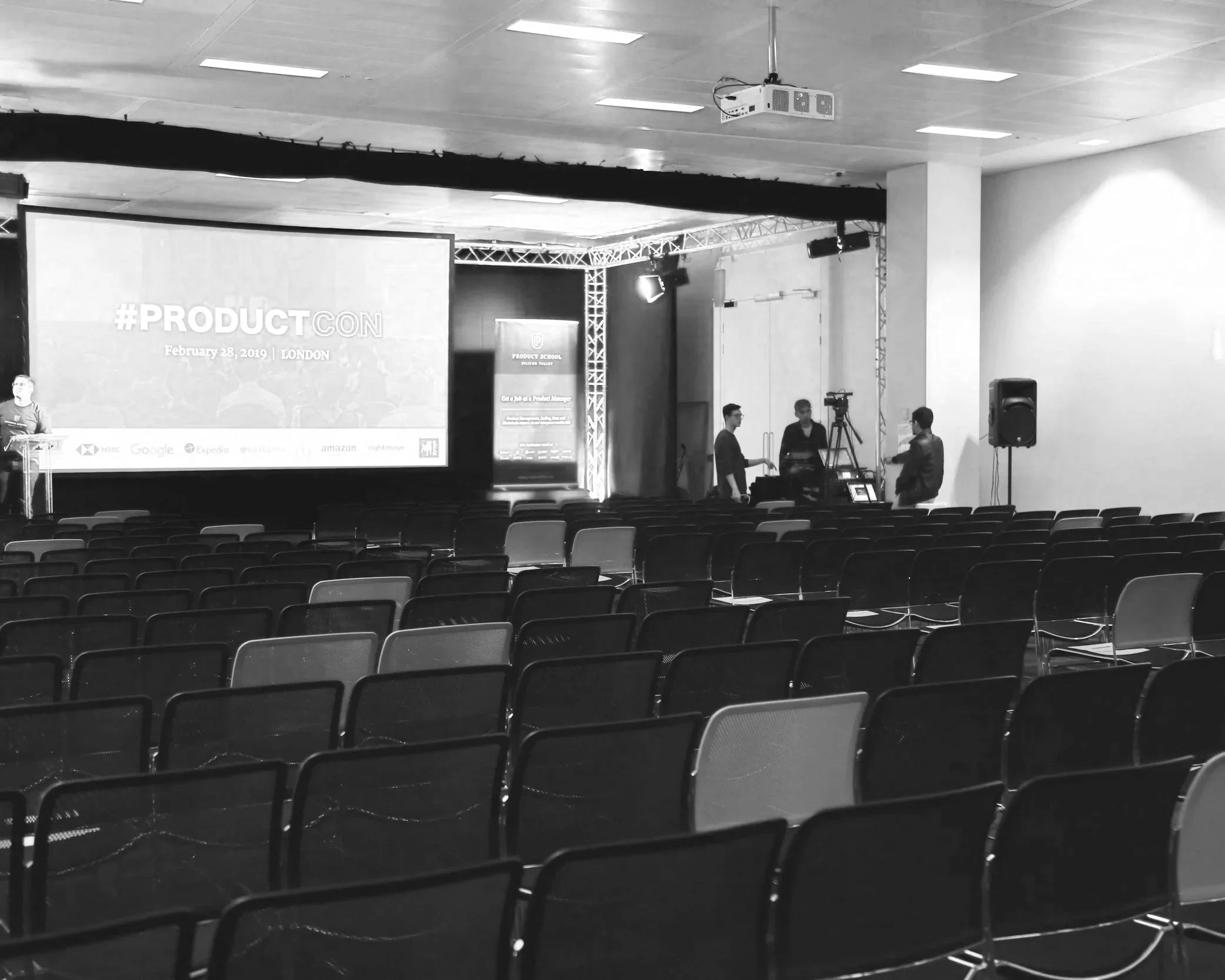 Headshot of smiling female tutor with long braids wearing a lanyard.
