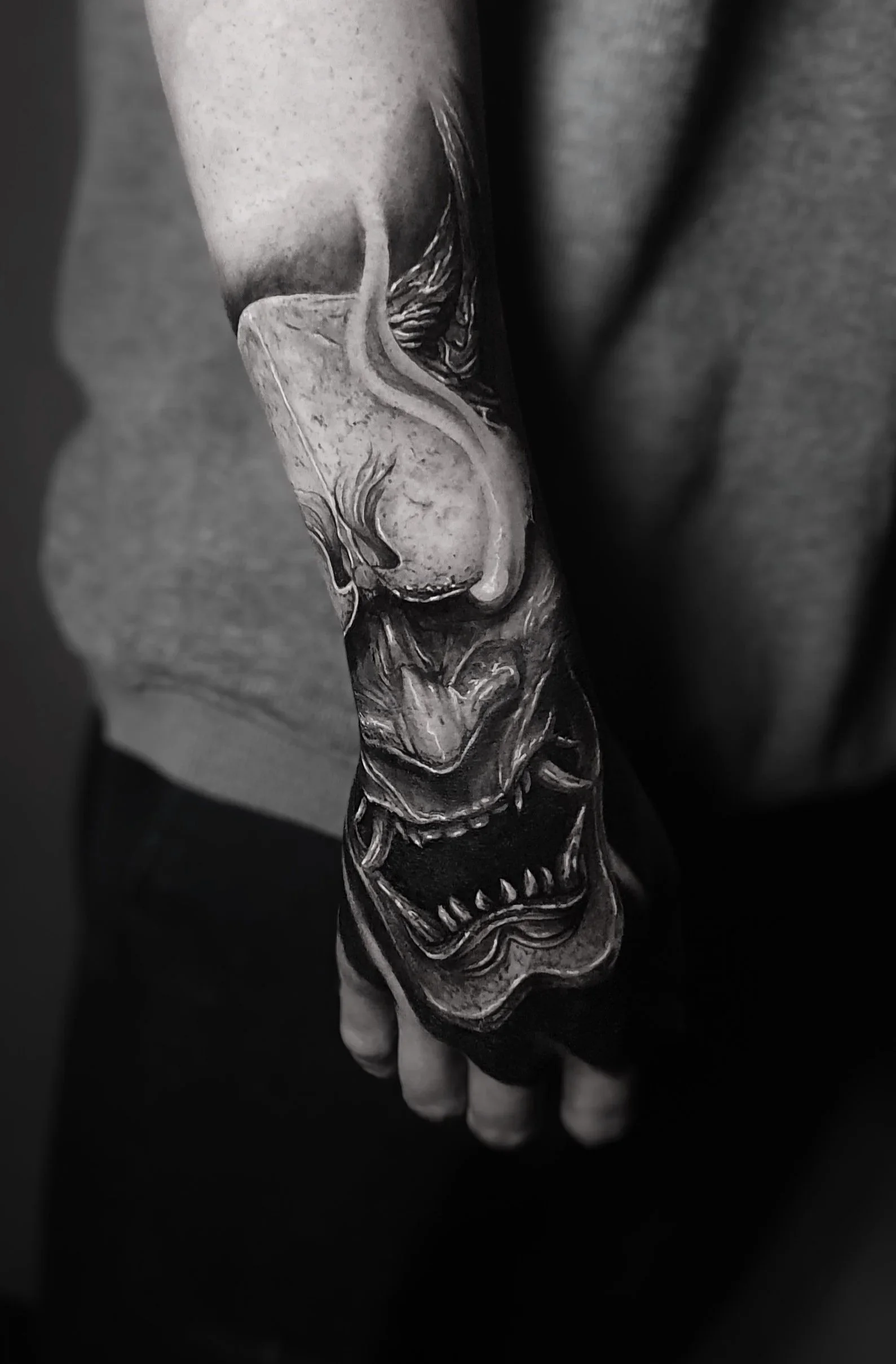 Black and white tattoo of a Japanese oni.