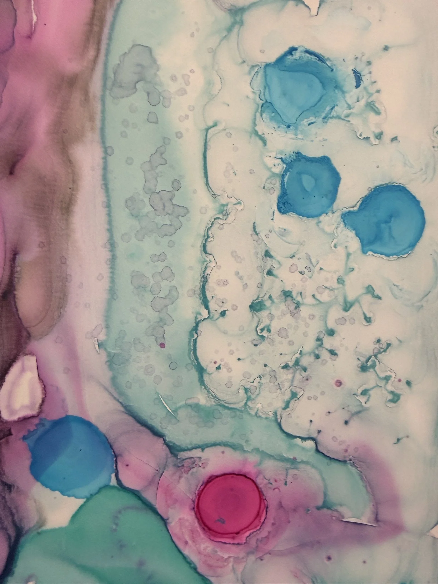 Abstract watercolor painting with blue, pink, green, and beige colors blending together.