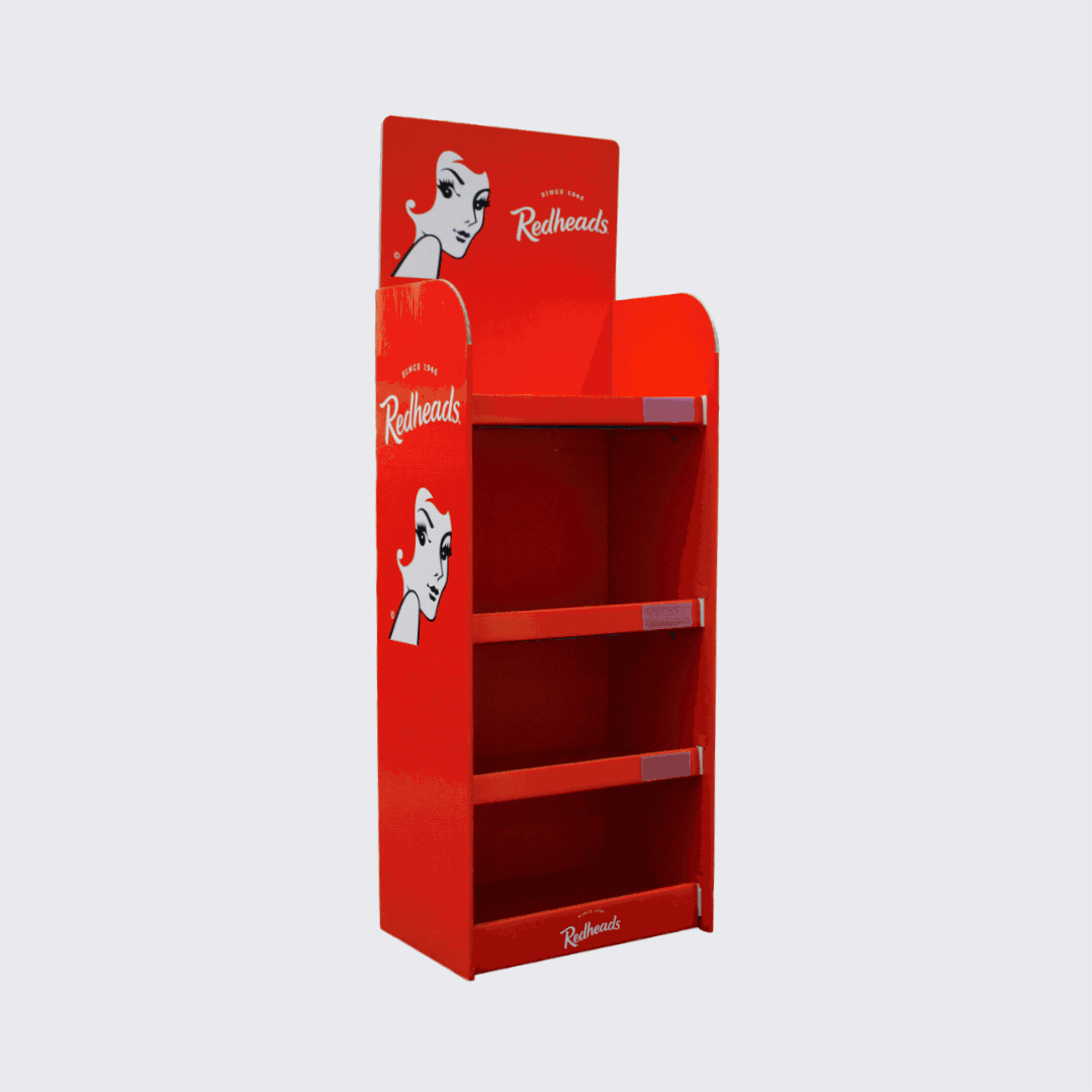 Red retail display shelf with branding for Redheads, featuring a retro style illustration of a woman with red hair, three empty shelves, and a top sign.