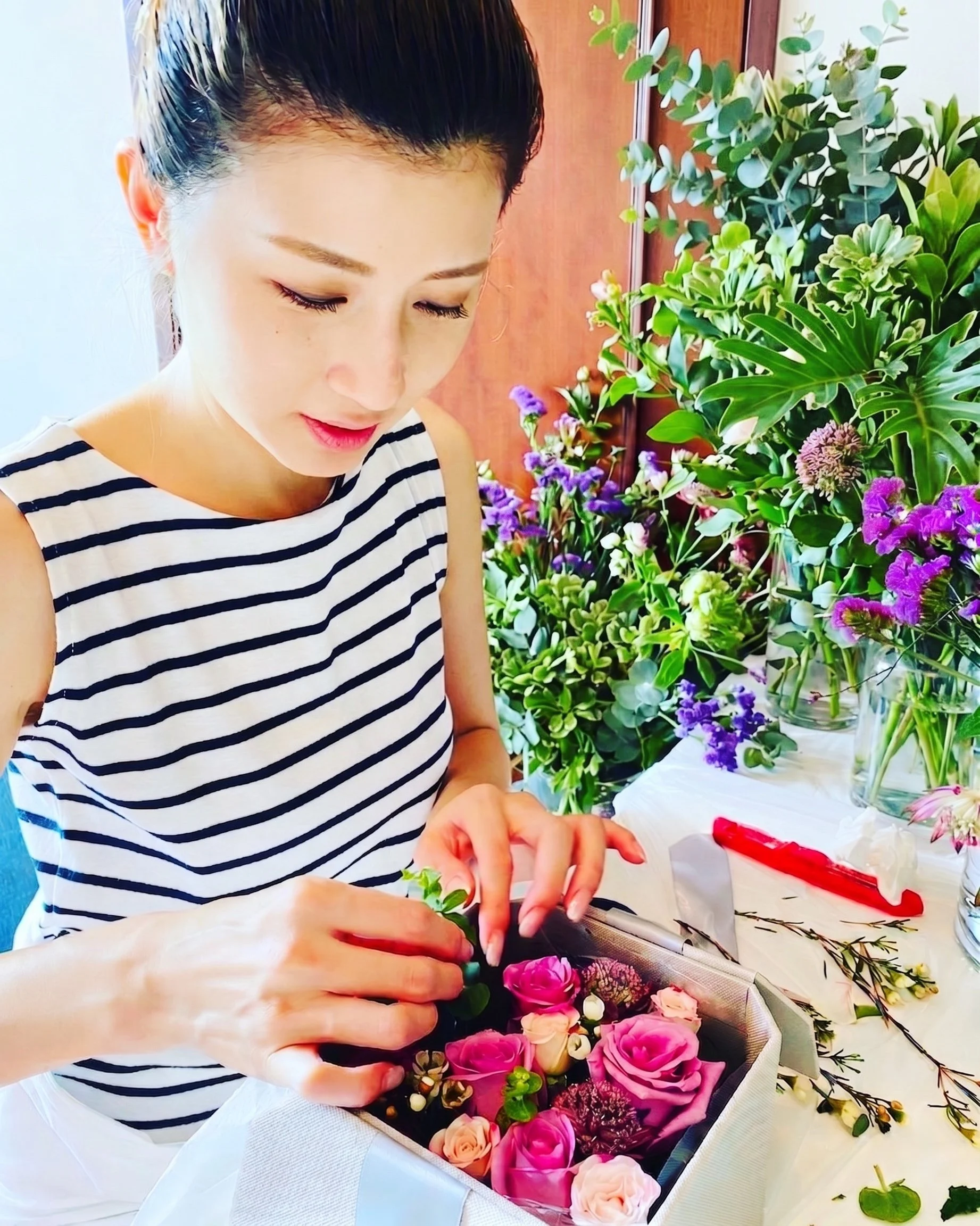 Winnie Chan, founder of VANORTEN, working on a botanical interior installation