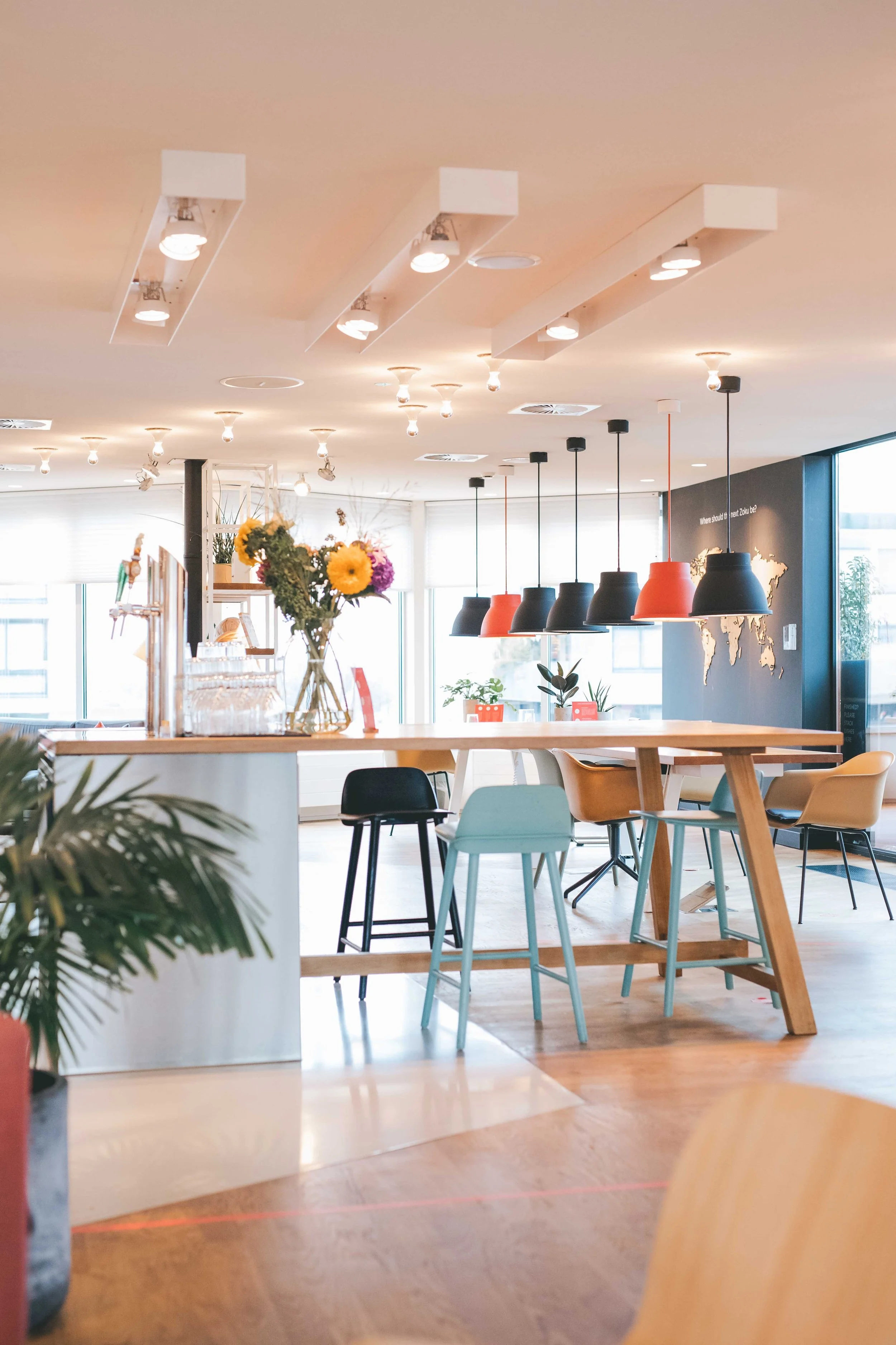 Botanical arrangement in a corporate pantry green life seats breath