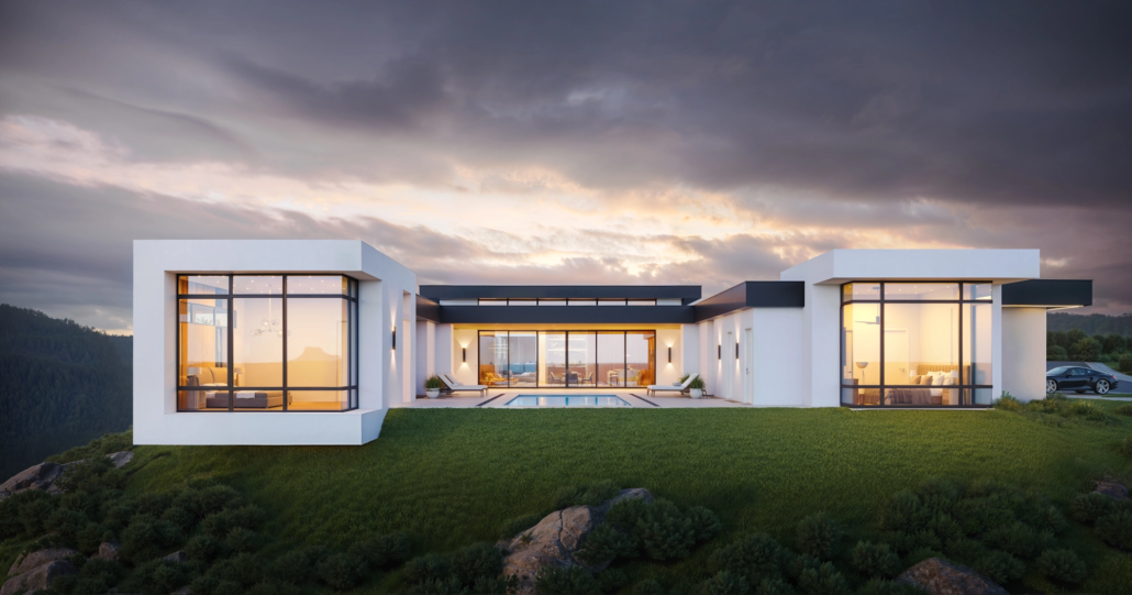 Modern house with large glass windows, a swimming pool, and a lawn, situated on a hill with a cloudy sky in the background.