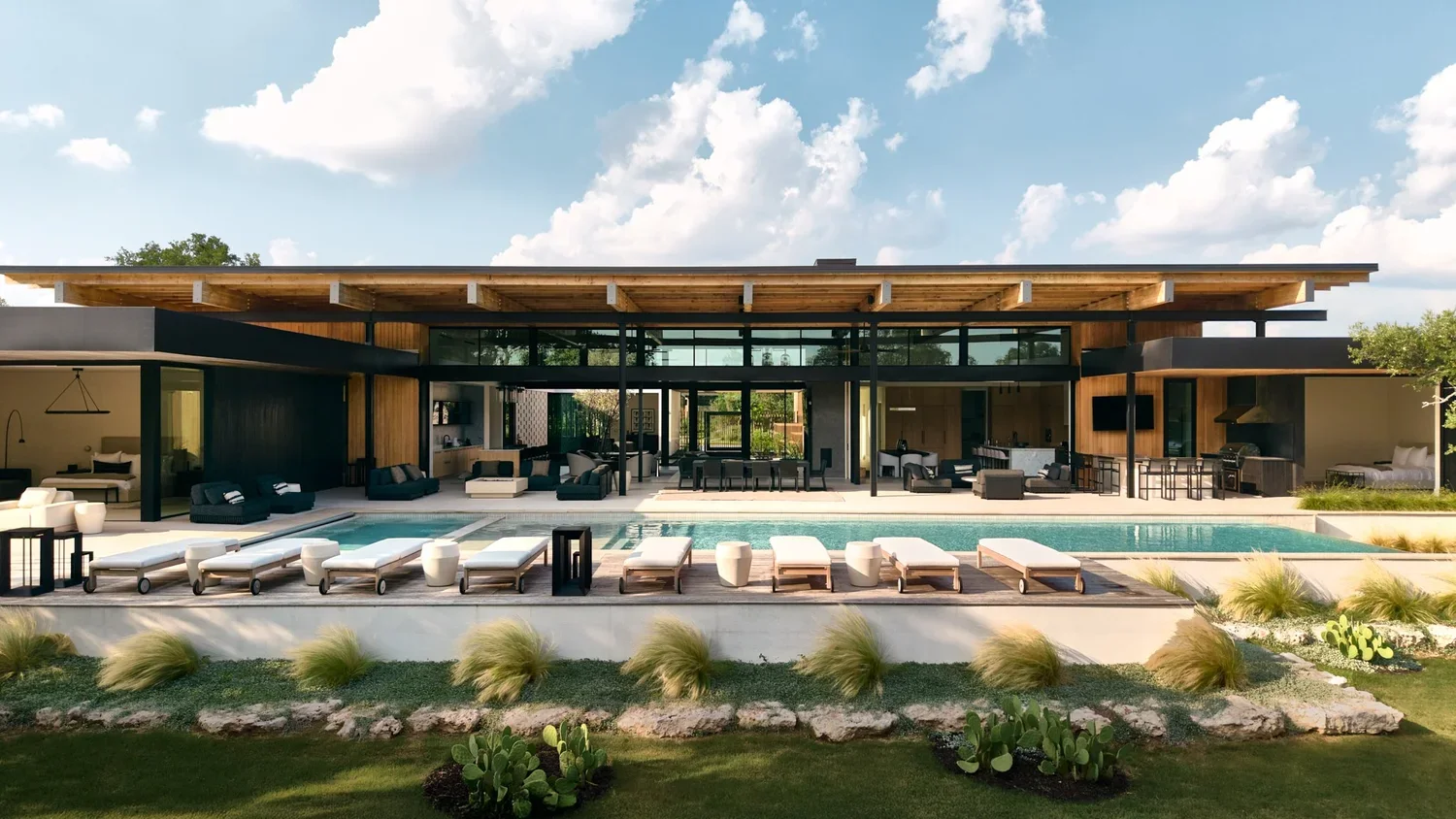 Modern house with outdoor pool and lounge chairs, set in a landscaped yard under a partly cloudy sky.