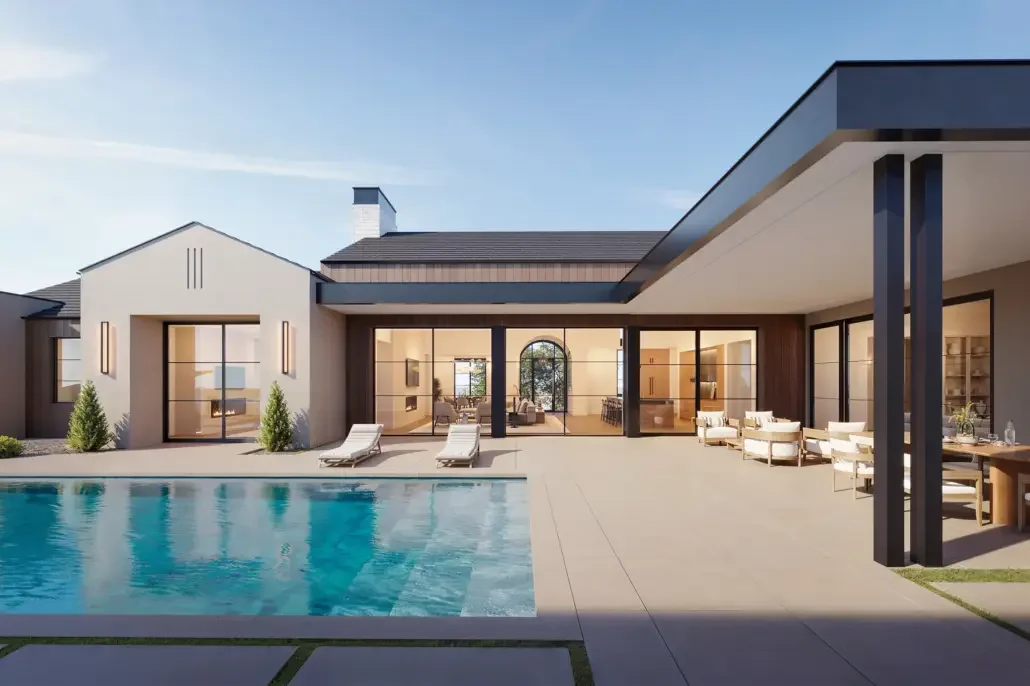 Modern house with glass walls, outdoor pool, and patio seating area.