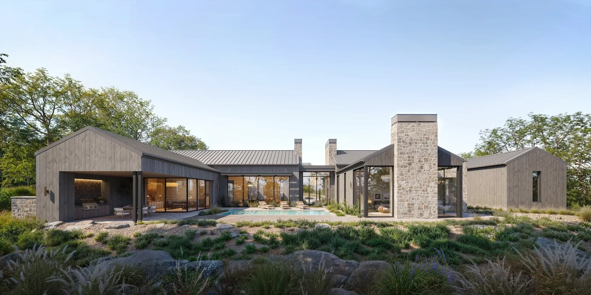 Modern house with large glass windows, stone and wooden exterior, surrounded by plants and trees, with a patio and swimming pool in the backyard.