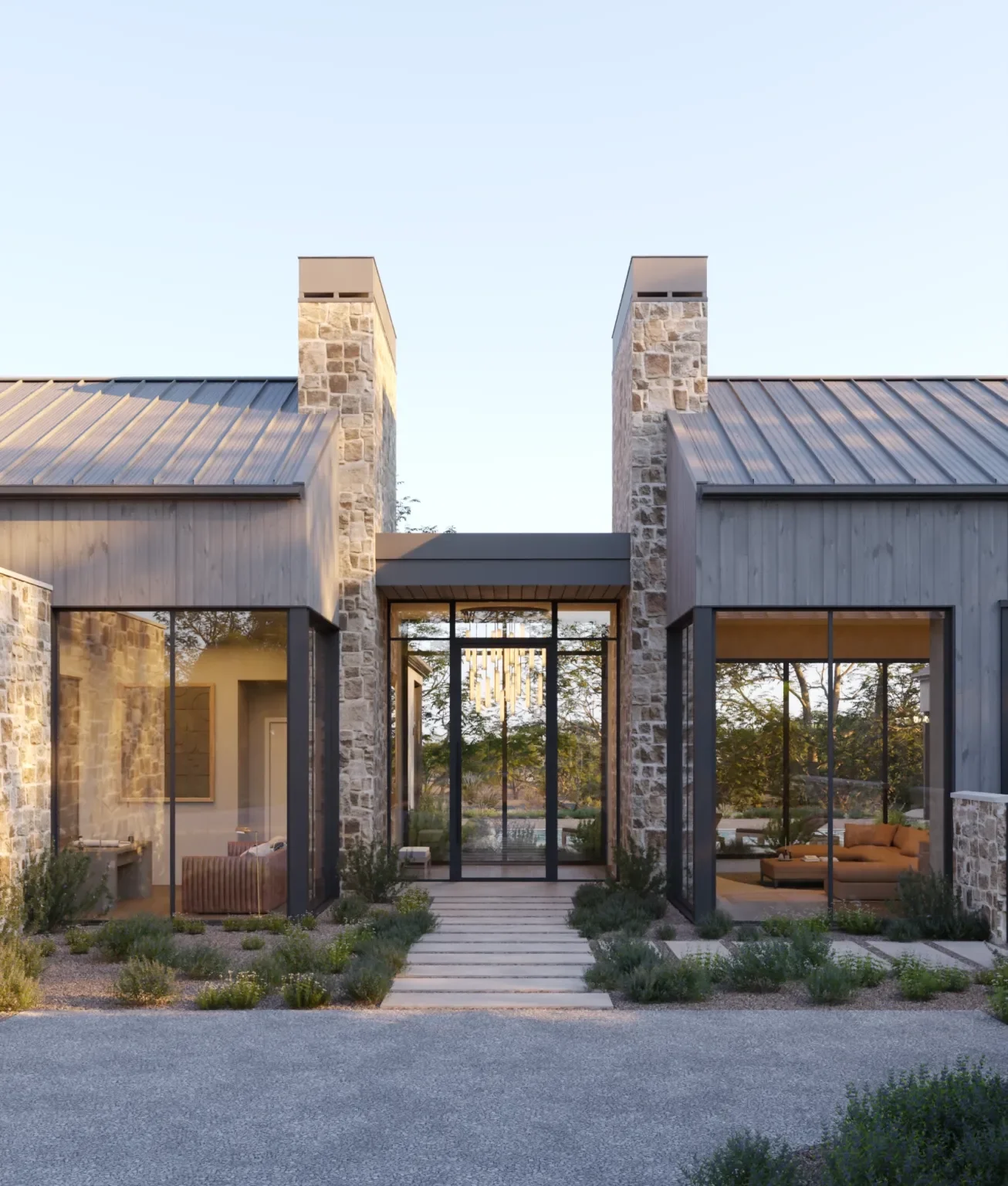 Modern house with stone and wood exterior, large glass doors, and landscaping with small shrubs.