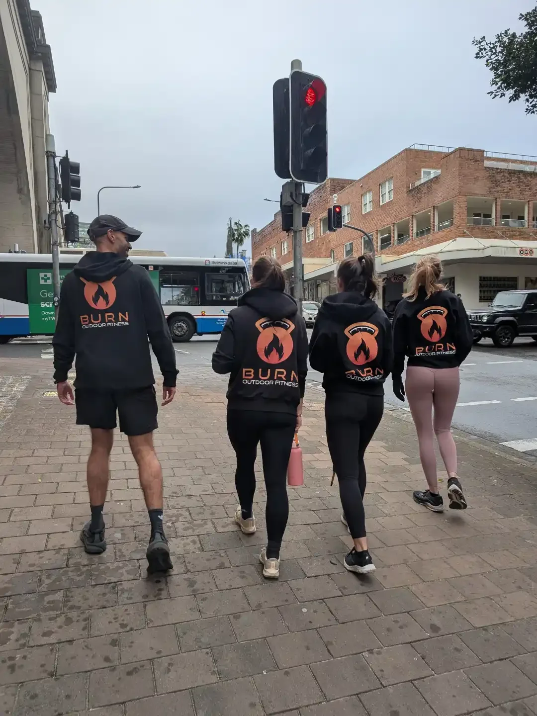 burn outdoor fitness members walking together