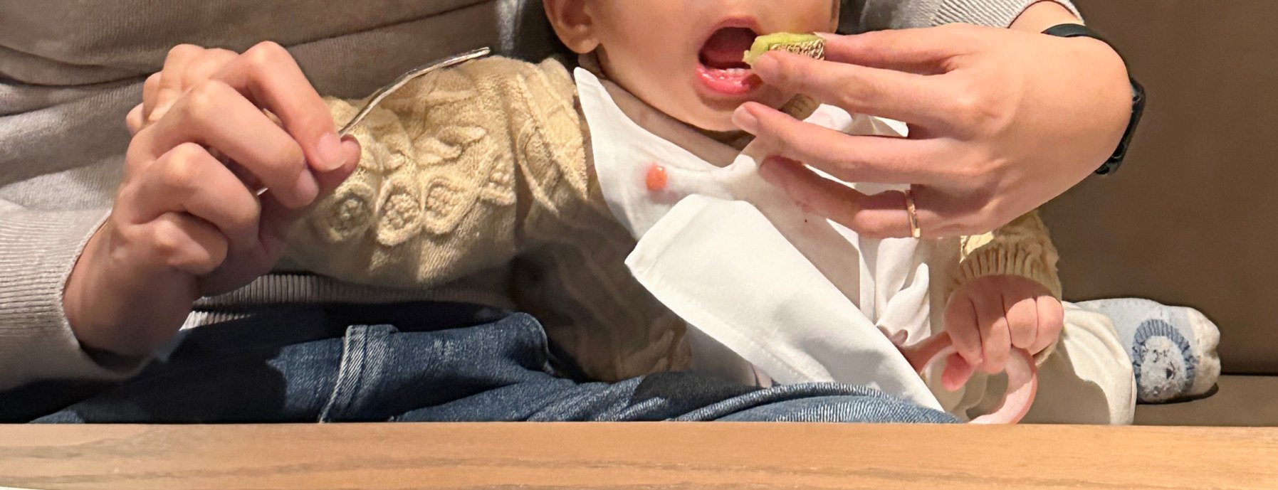 Baby eating fruit snack at Kamenoi Hotel