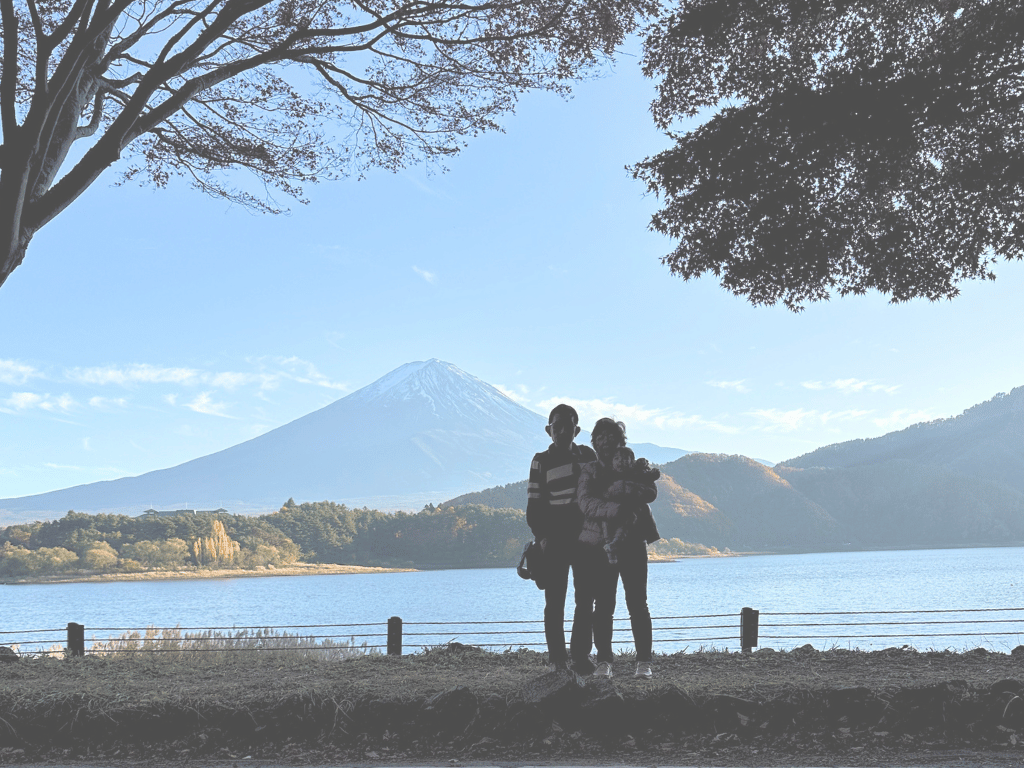 Family at Lake Kawaguchi with Mount Fuji, autumn foliage