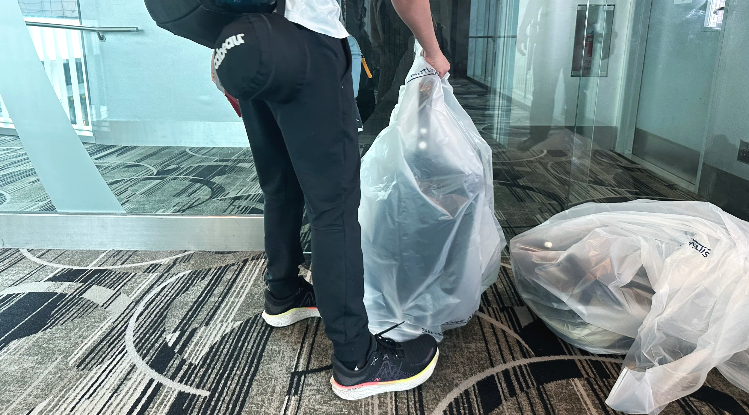 Stroller wrapped for gate check-in, Singapore Changi Airport Airport