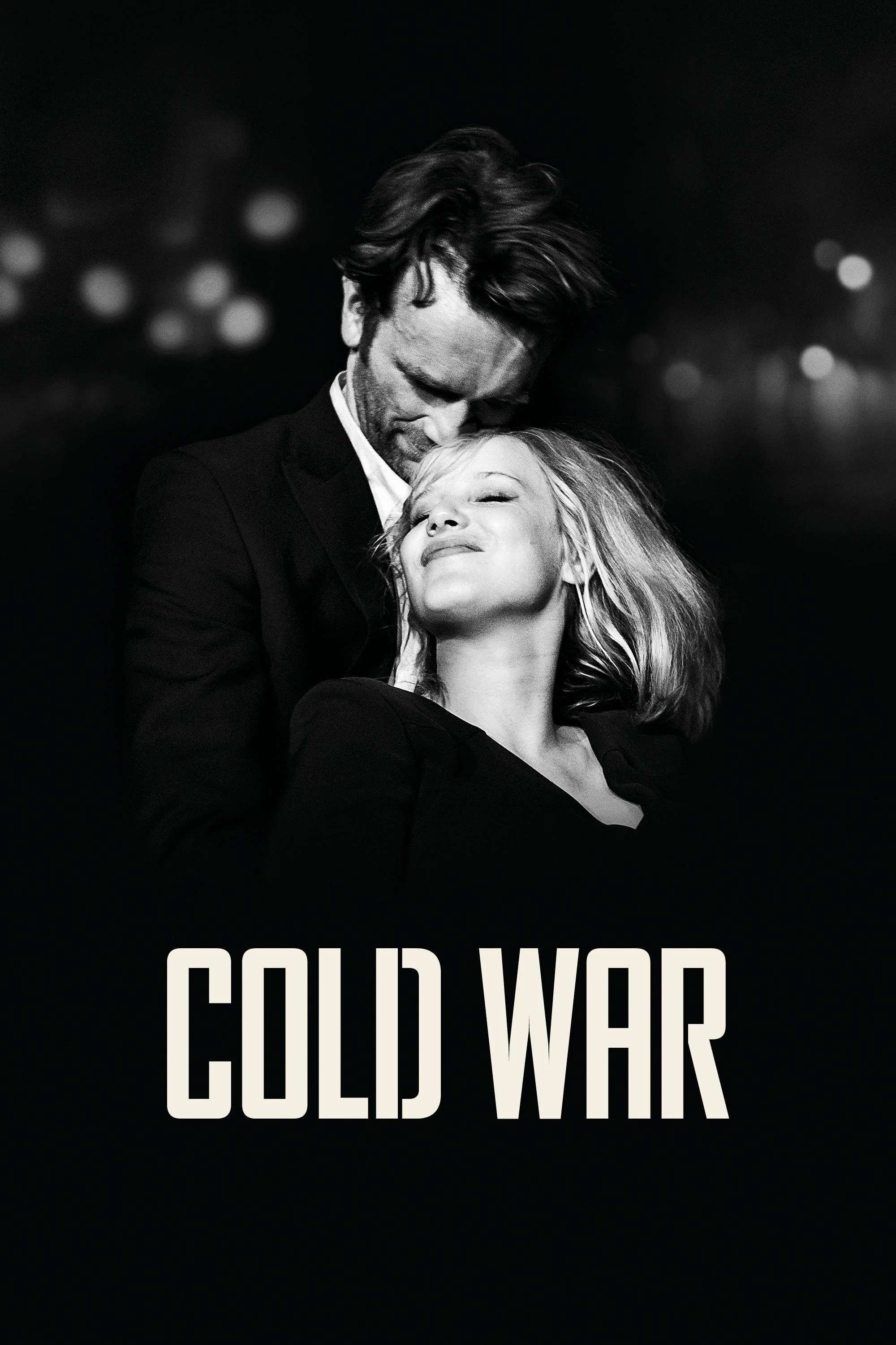 Black and white image of a man and woman in a close, intimate pose with the man gently resting his head on the woman's forehead. The woman has her eyes closed and a serene expression. The word 'COLD WAR' is partially visible at the bottom of the image.