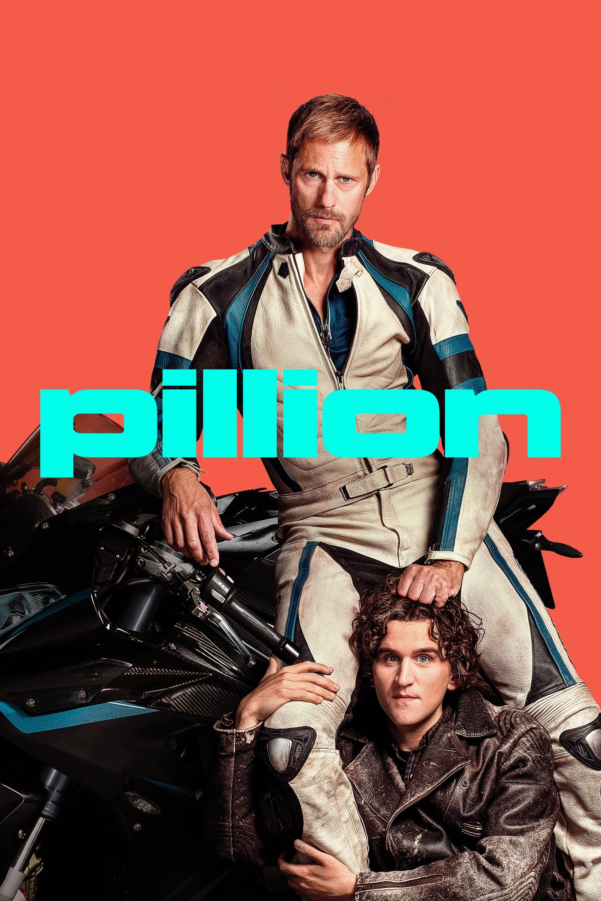 Two men in motorcycle gear posing with a black motorcycle on a red background. The man on top has light brown hair, blue eyes, and a serious expression. The man below has curly dark brown hair and is wearing a black leather jacket.