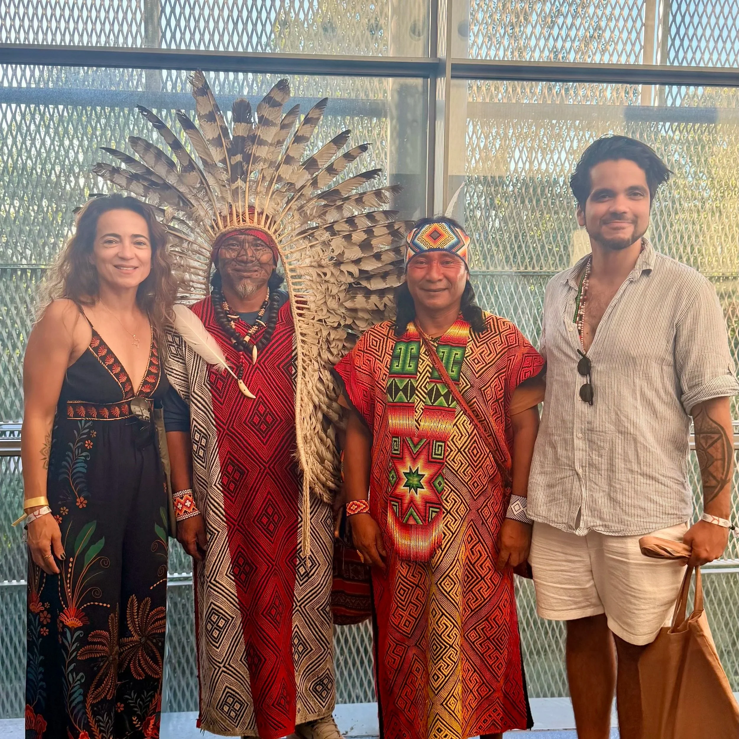 KAIRÉ team with Huni Kuin indigenous leaders from Brazil in traditional ceremonial regalia during world ayahuasca forum 2026 in Girona